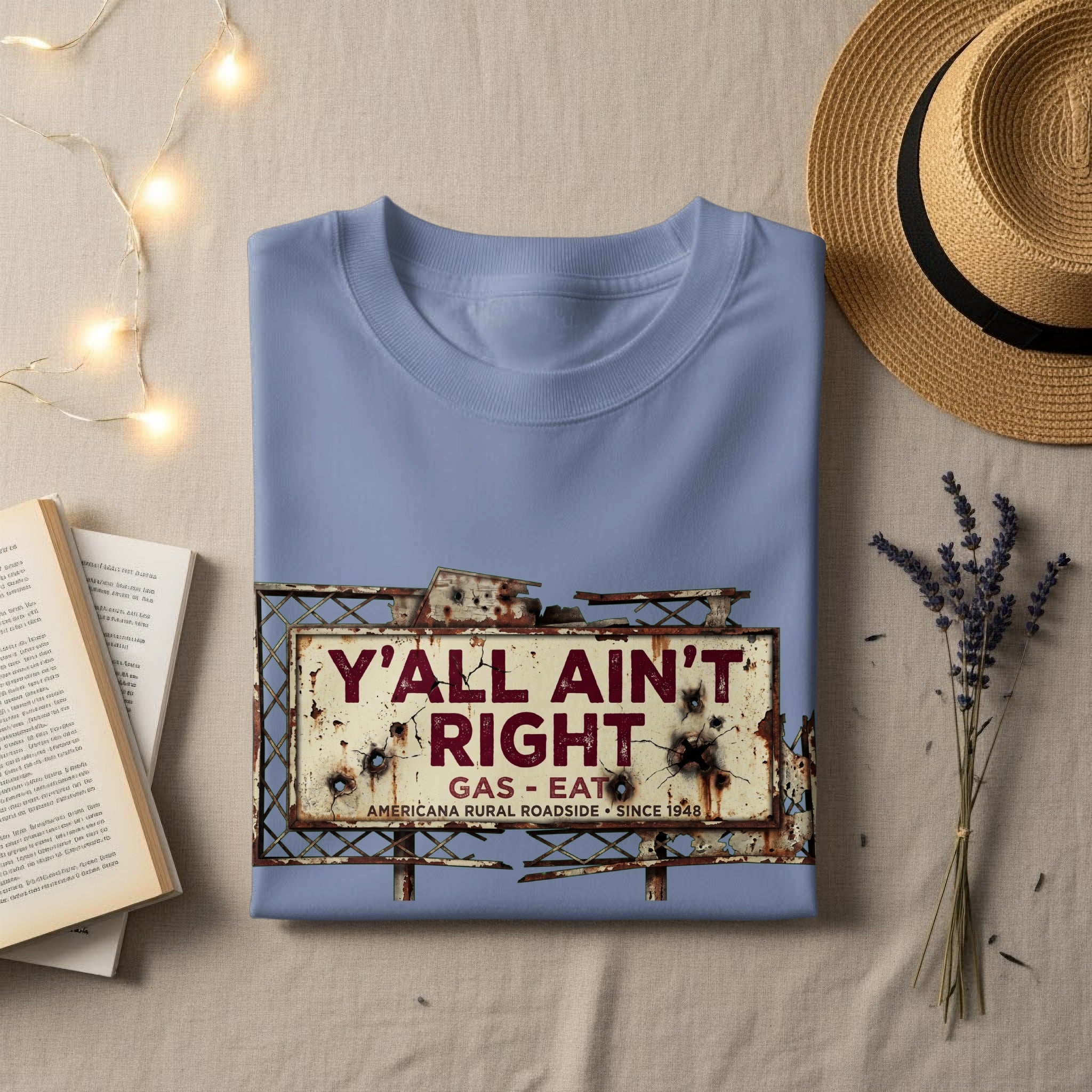 Blue t-shirt with distressed "Y'all Ain't Right" gas station sign graphic.