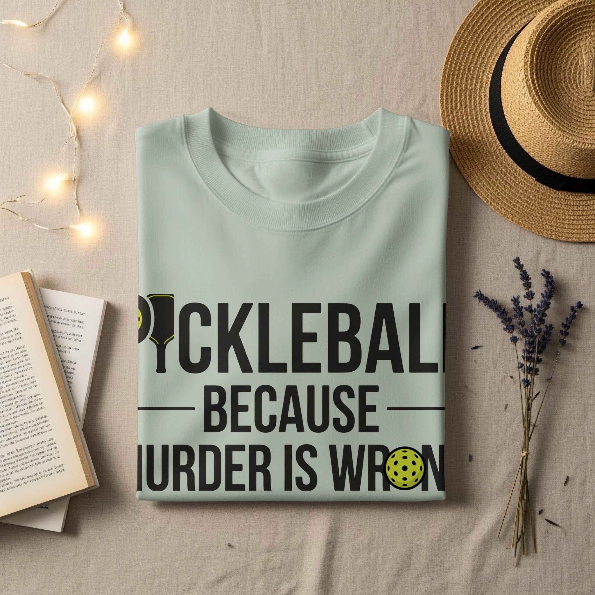 Light green t-shirt with "PICKLEBALL BECAUSE MURDER IS WRONG" text.