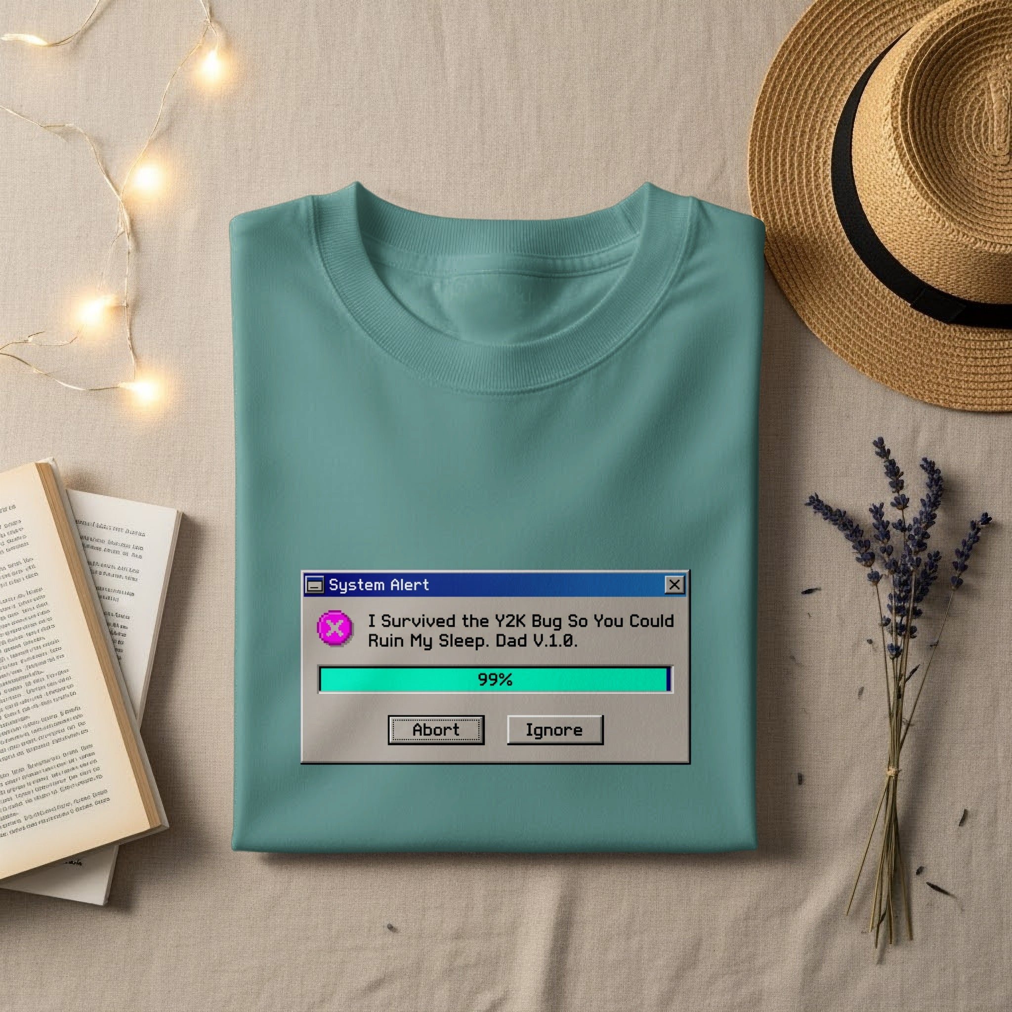 Teal t-shirt with "System Alert" graphic about Y2K bug and sleep.