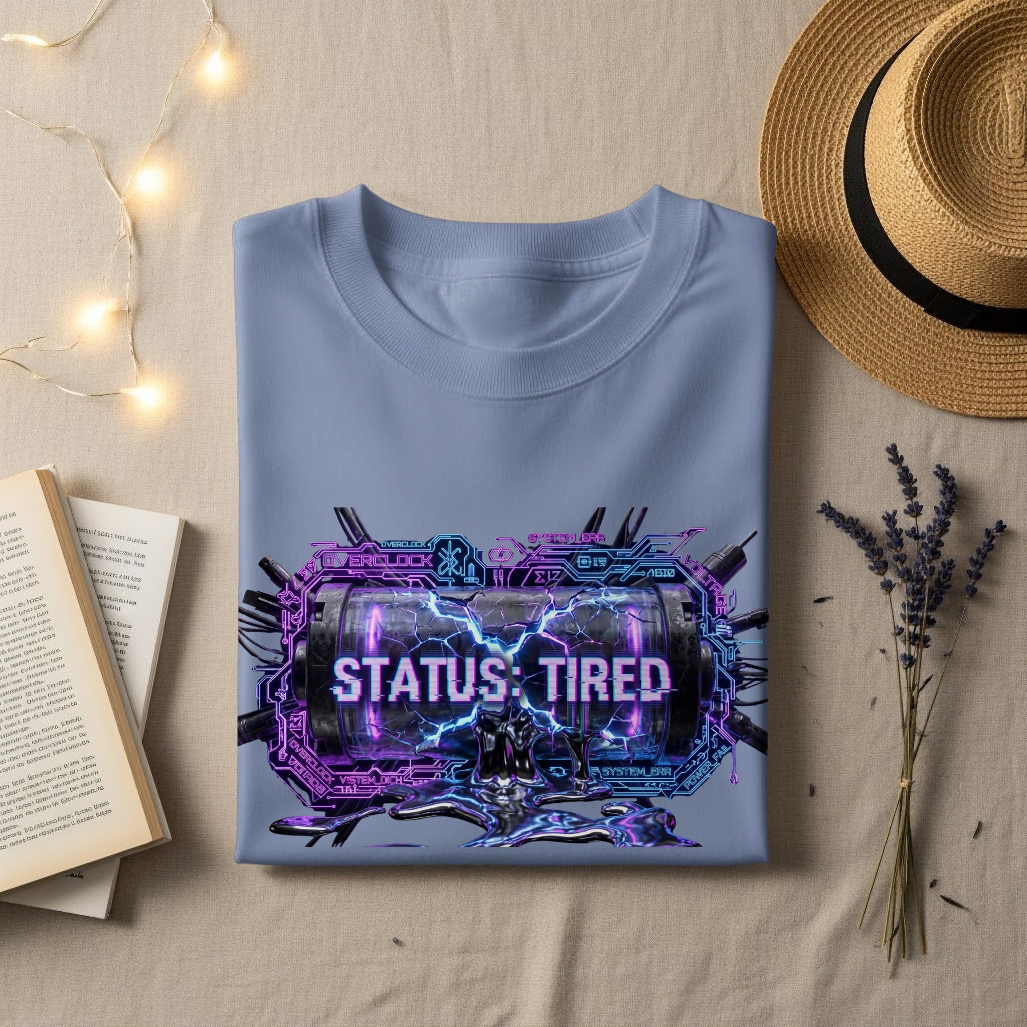 Light blue t-shirt with "STATUS: TIRED" text and futuristic graphics.