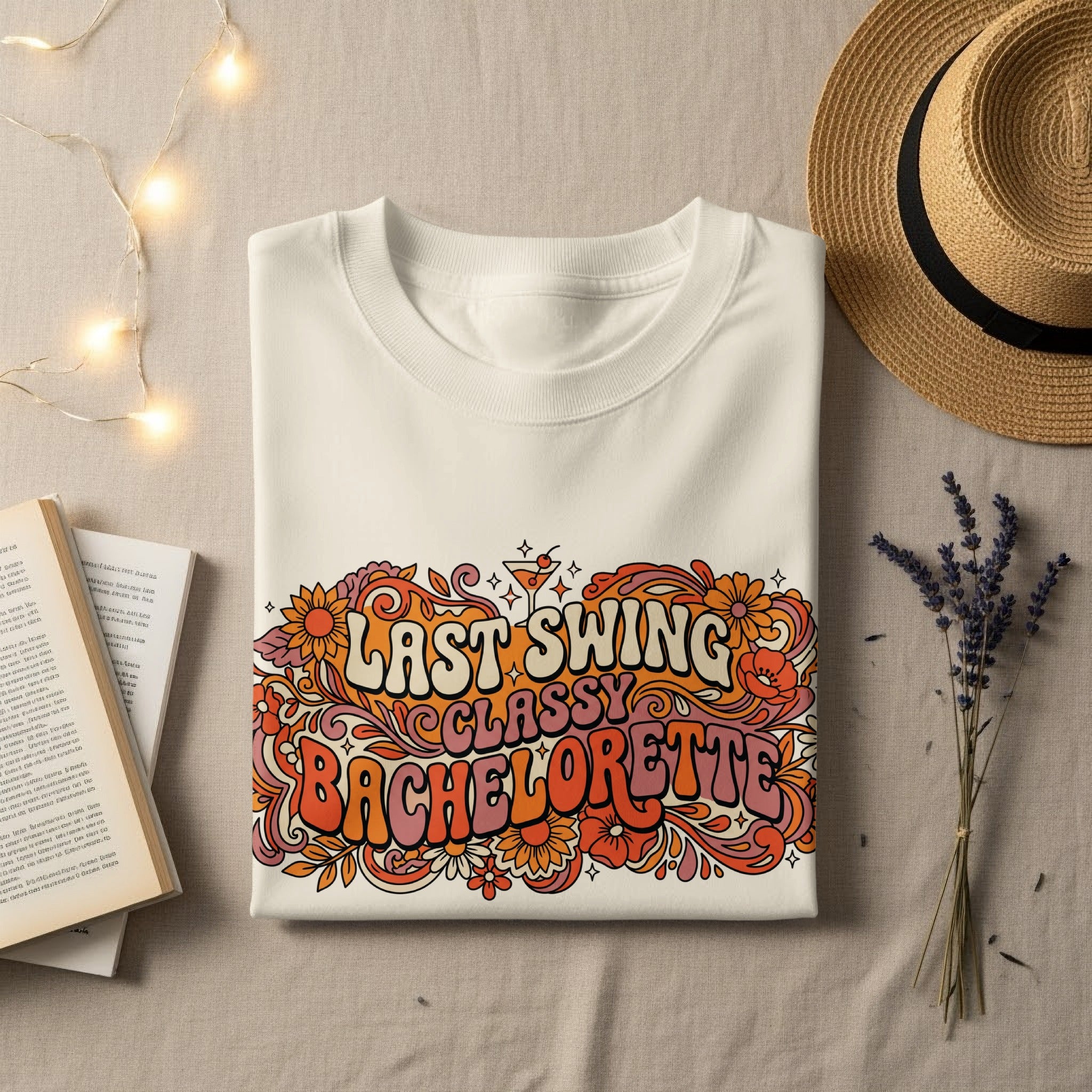 Last Swing Bachelorette text on a white sweatshirt with floral accents.