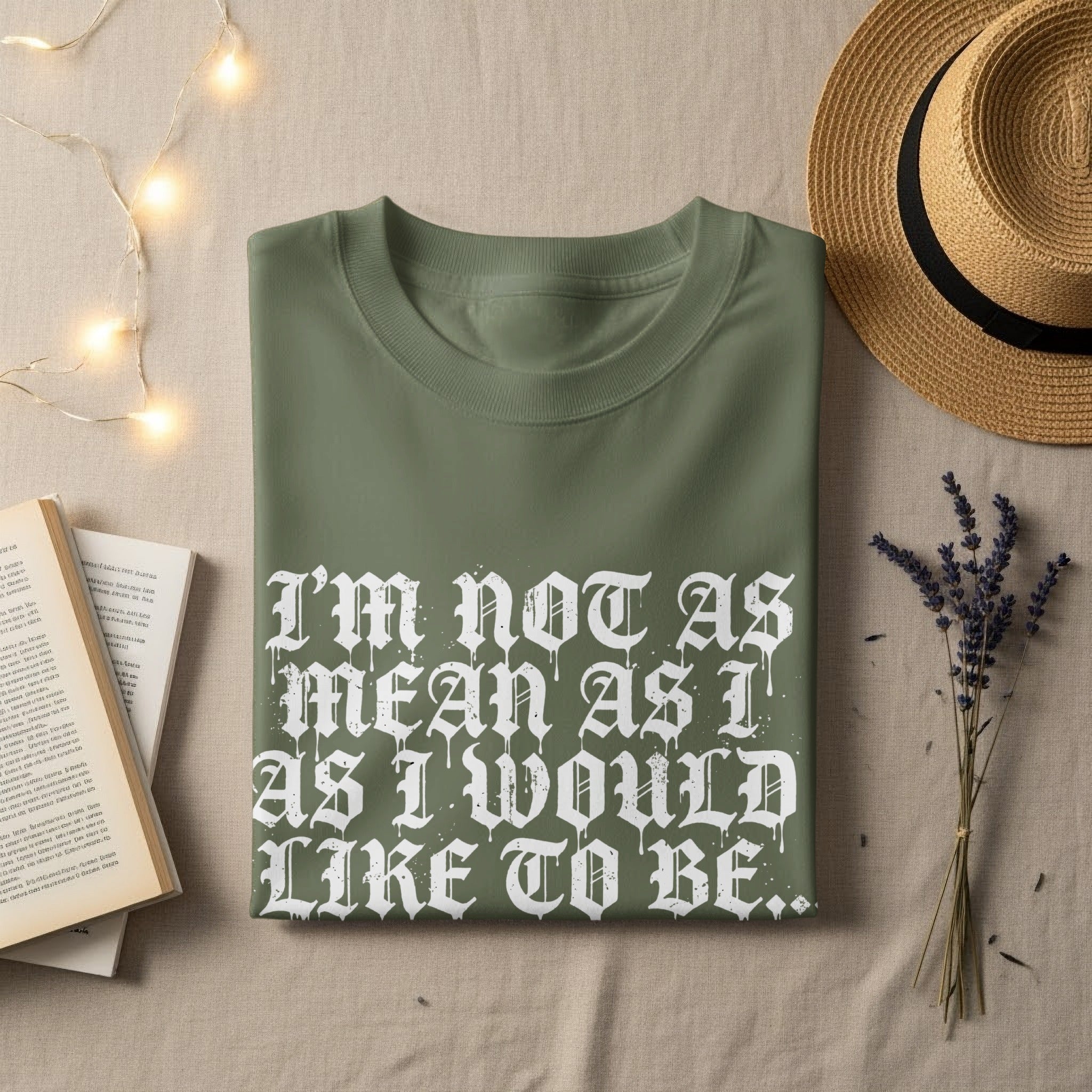 Olive green t-shirt with white gothic font text "I'm not as mean as I would like to be."