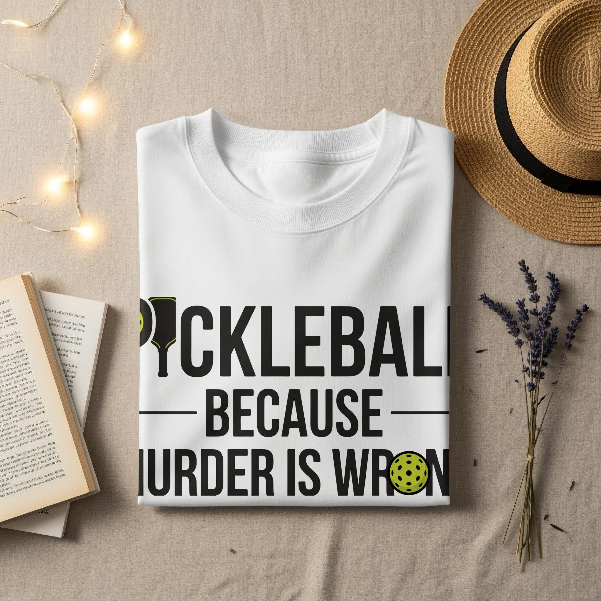 White t-shirt with "PICKLEBALL - BECAUSE MURDER IS WRONG" text.
