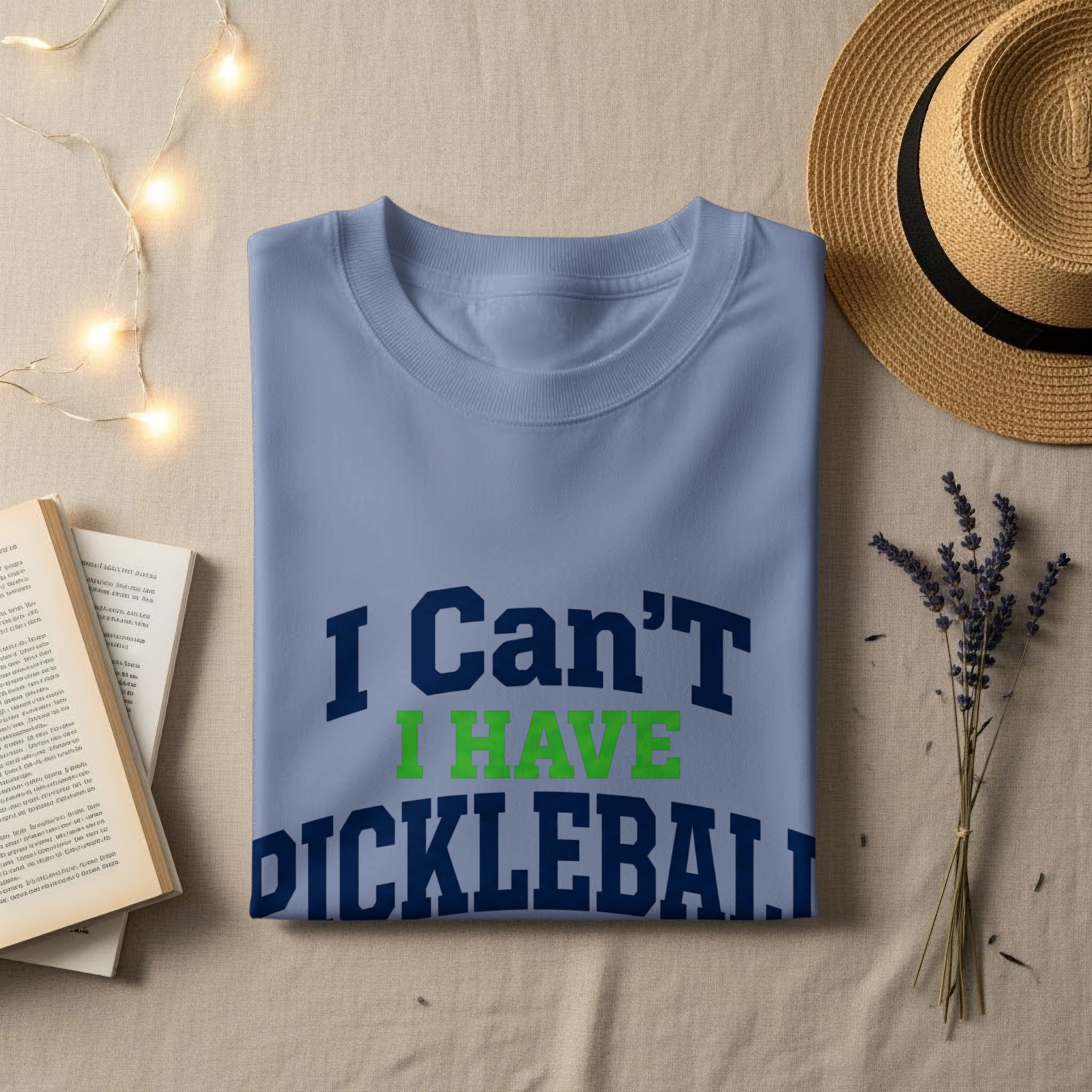 Light blue t-shirt with "I Can't I HAVE PICKLEBALL" text.