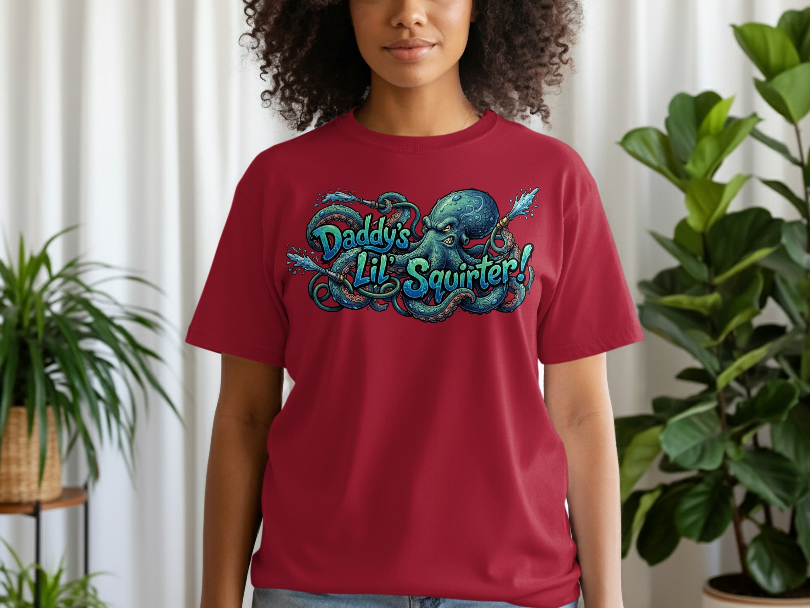 Burgundy t-shirt with a green octopus and "Daddy's Lil' Squirt" text.