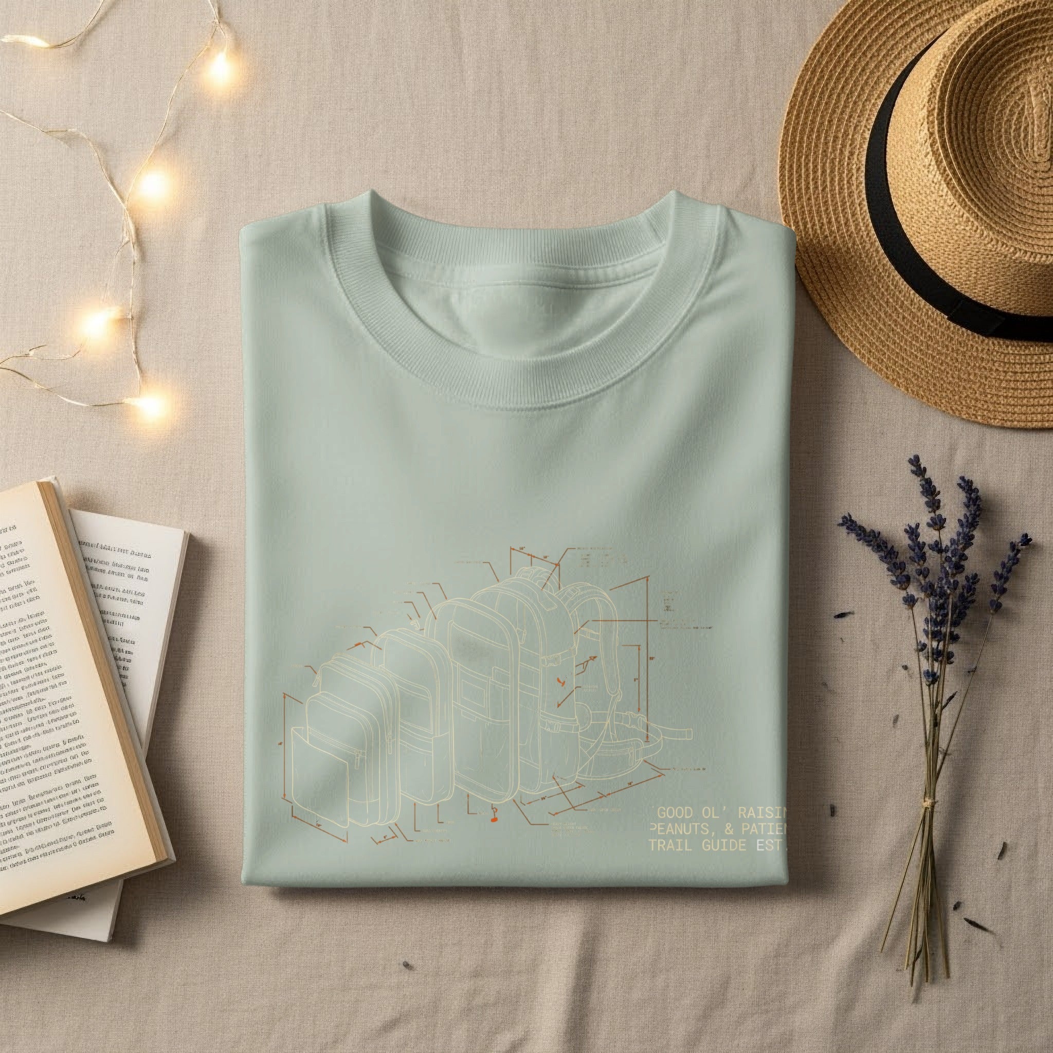 Light mint t-shirt with isometric line drawing of backpacks, "GOOD OL' RAISIN" text.