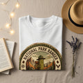 White t-shirt with a "National Park Ranger" pickle character and backpack emblem.