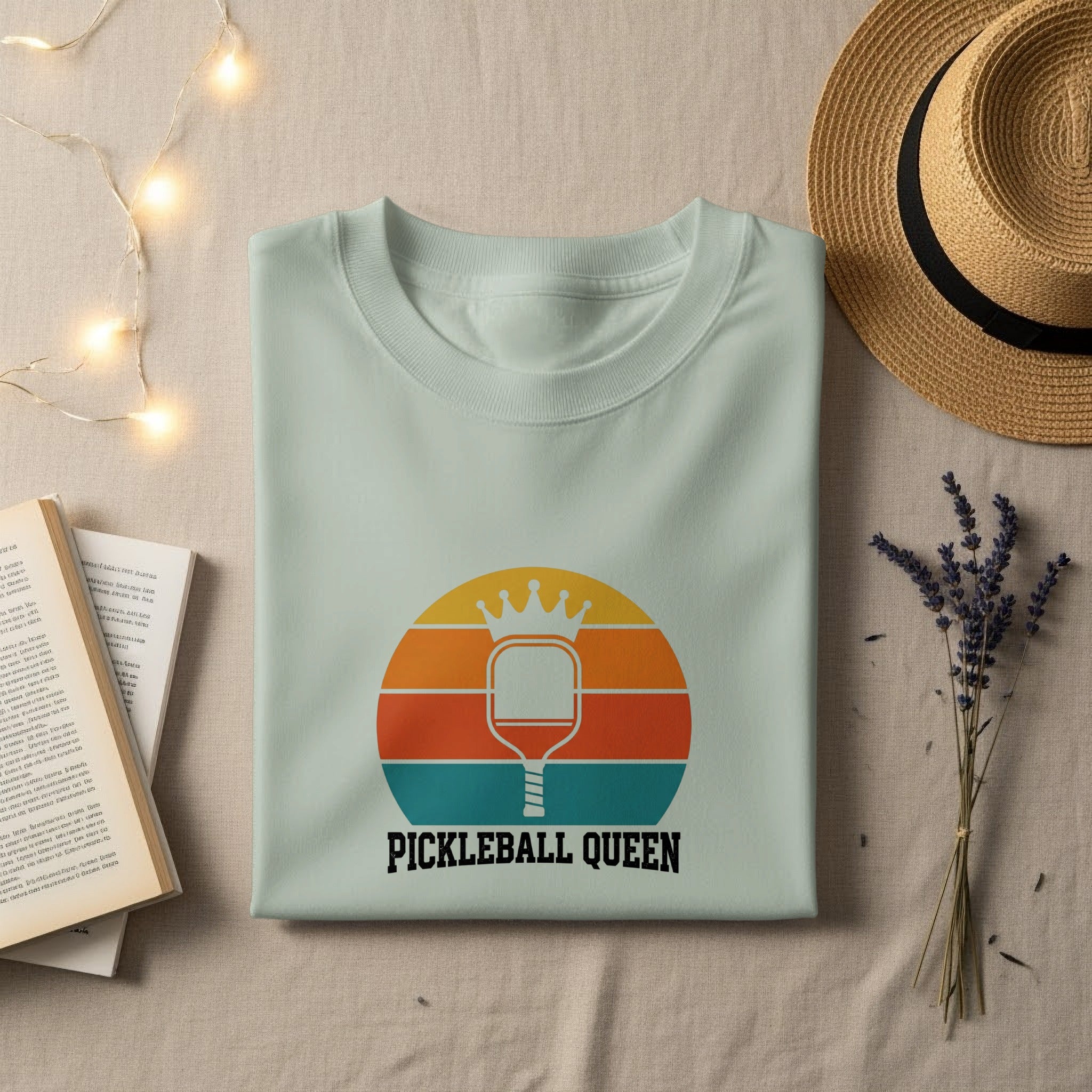 Light mint green t-shirt with "Pickleball Queen" graphic featuring a crown and paddle.