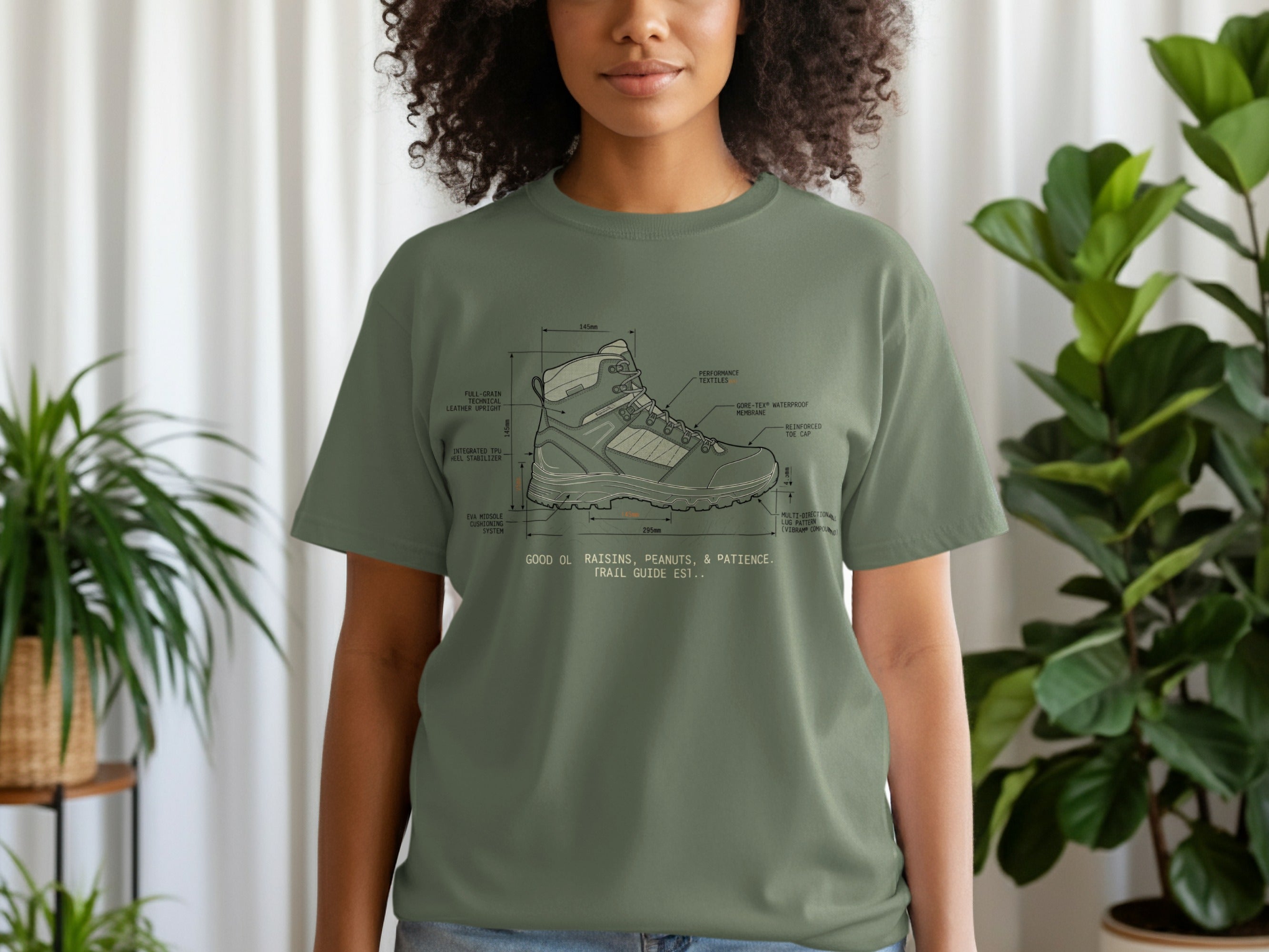 Olive green t-shirt with diagram of a hiking boot, including technical details.