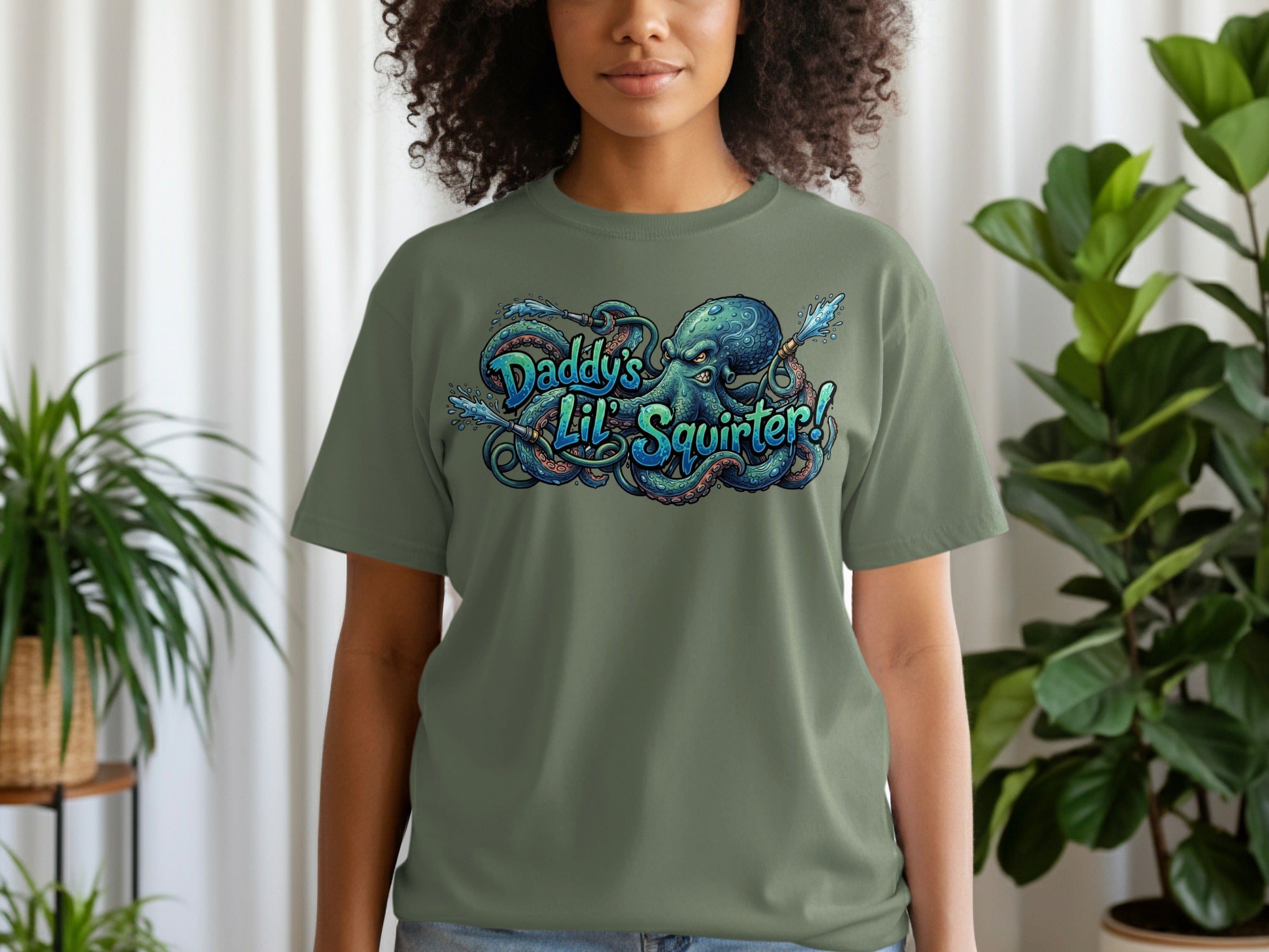 Green t-shirt with "Daddy's Lil' Squirter!" octopus graphic.
