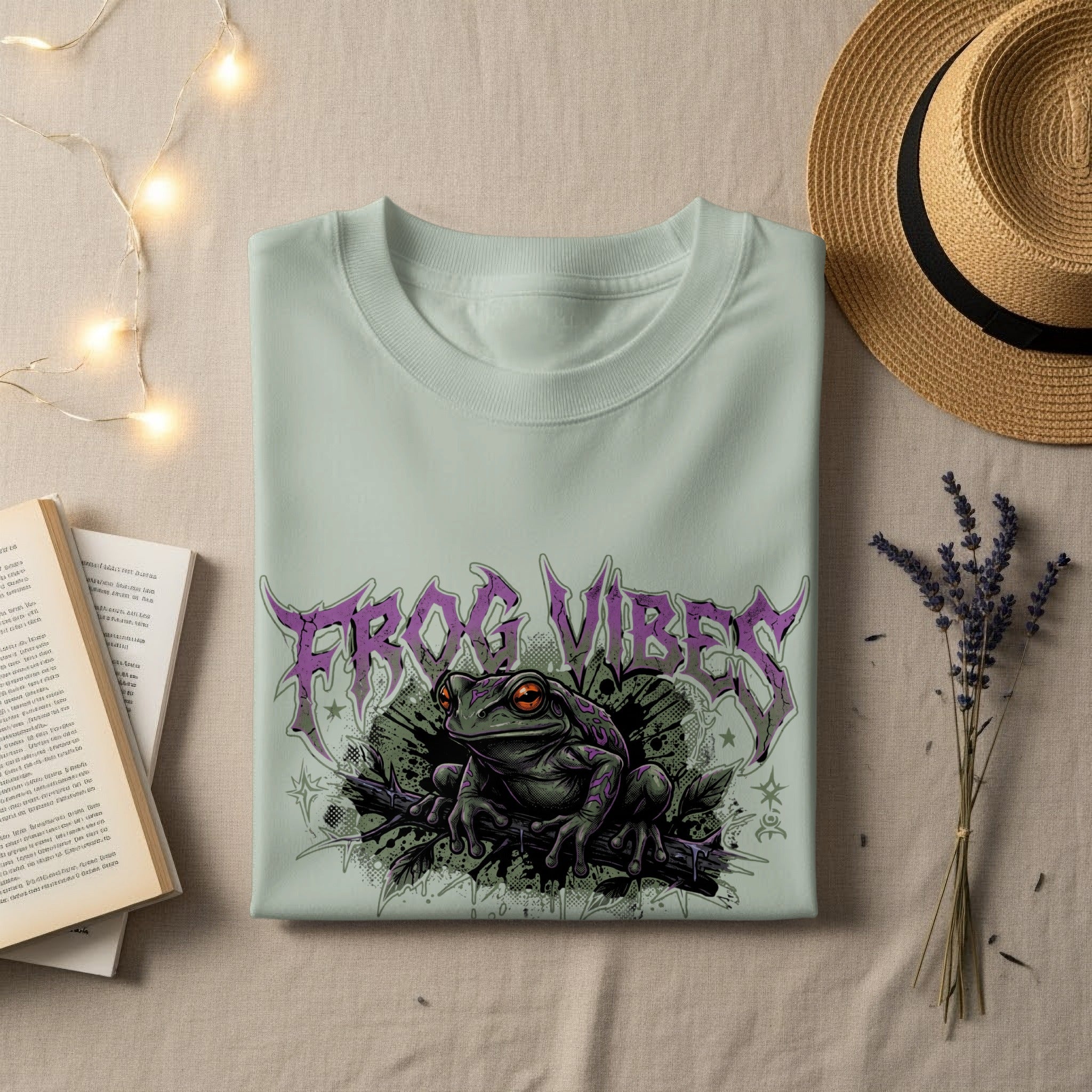 Light mint t-shirt with "FROG VIBES" text and a green frog illustration.