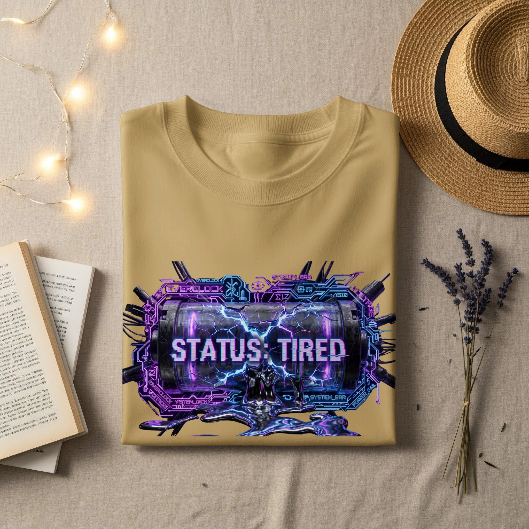 Tan t-shirt with "STATUS: TIRED" text and circuit board graphic.