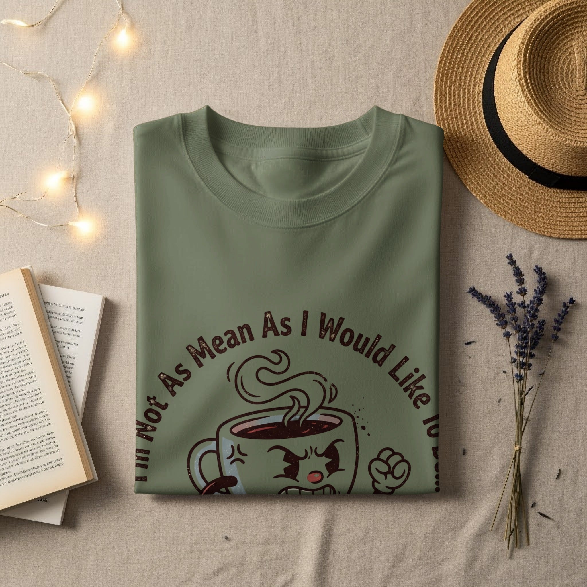 Olive green t-shirt with "Not As Mean As I Would Like" text and coffee cup graphic.