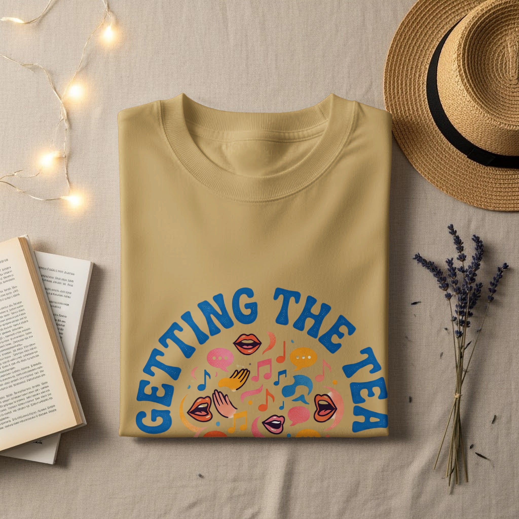 T-shirt with "Getting the Tea" text and colorful graphics of mouths and speech bubbles.