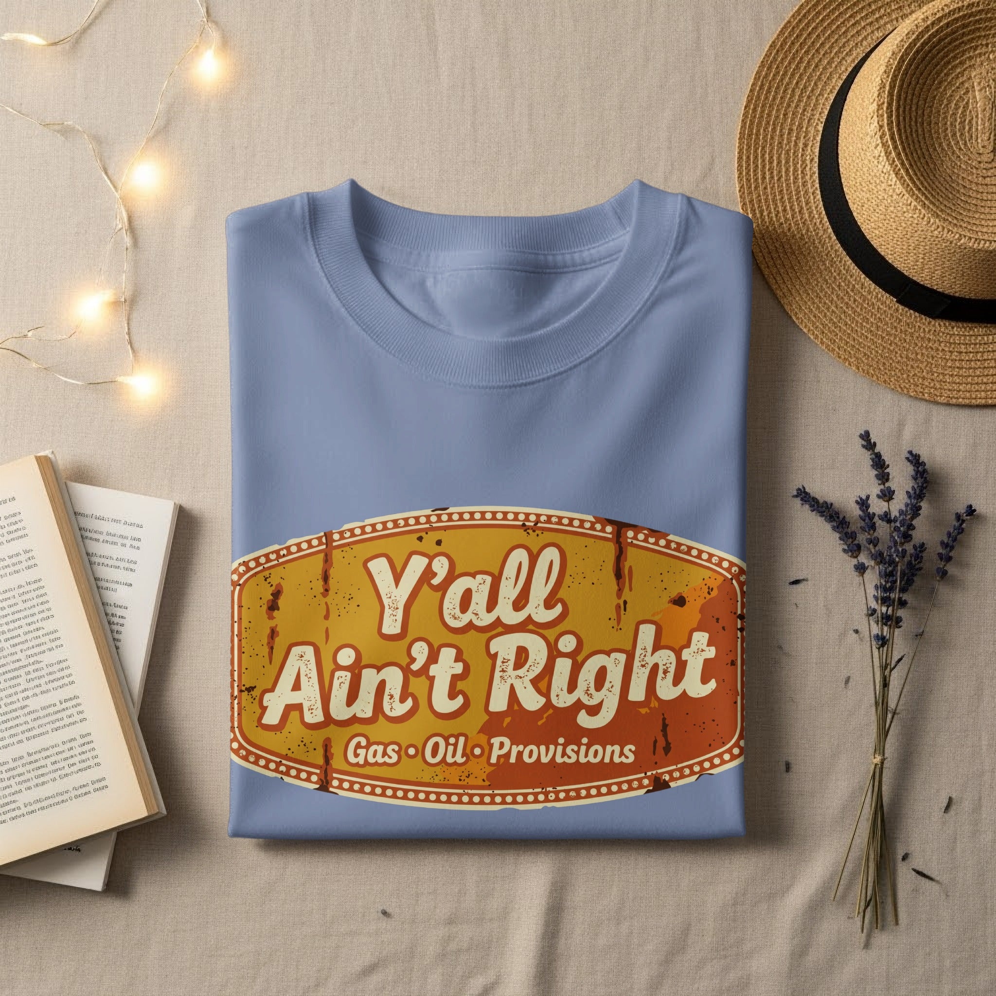 Light blue t-shirt with "Y'all Ain't Right Gas Oil Provisions" text on a distressed sign.