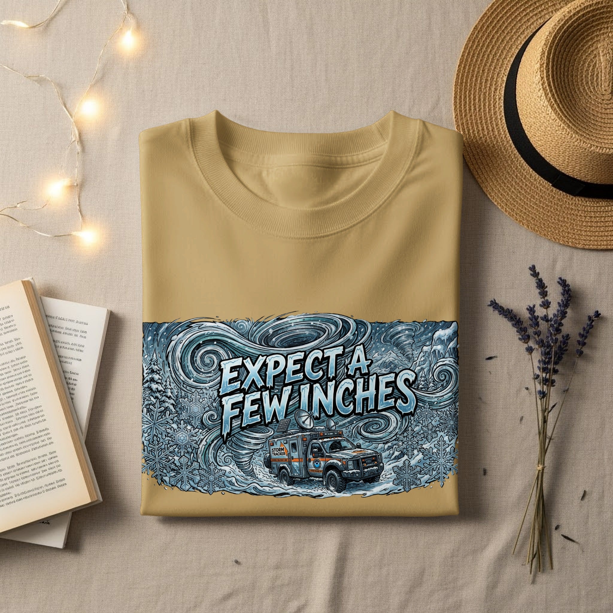 Tan t-shirt with "Expect a few inches" text and storm truck graphic.