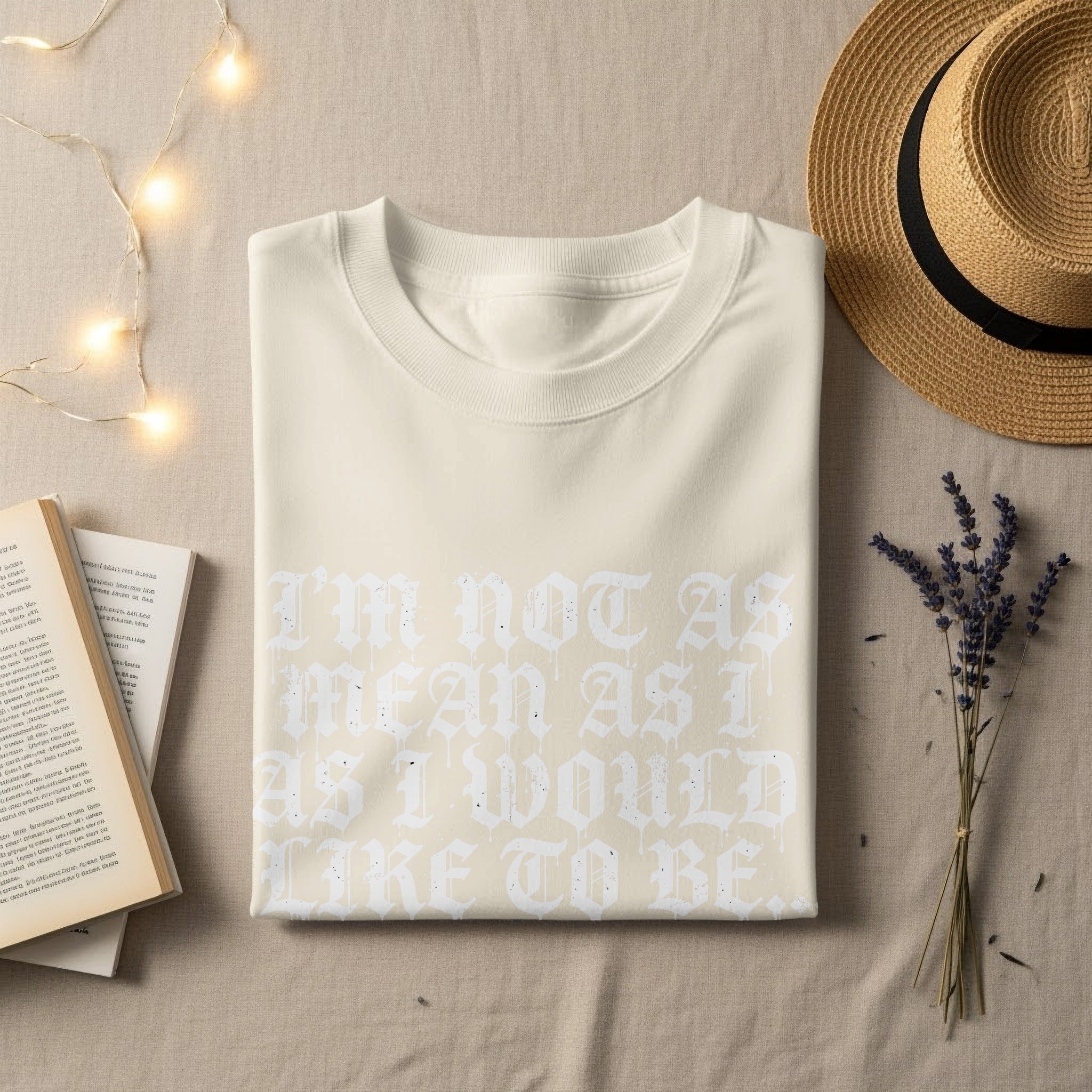 Cream t-shirt with white gothic text reading "I'm not as mean as I would like to be."
