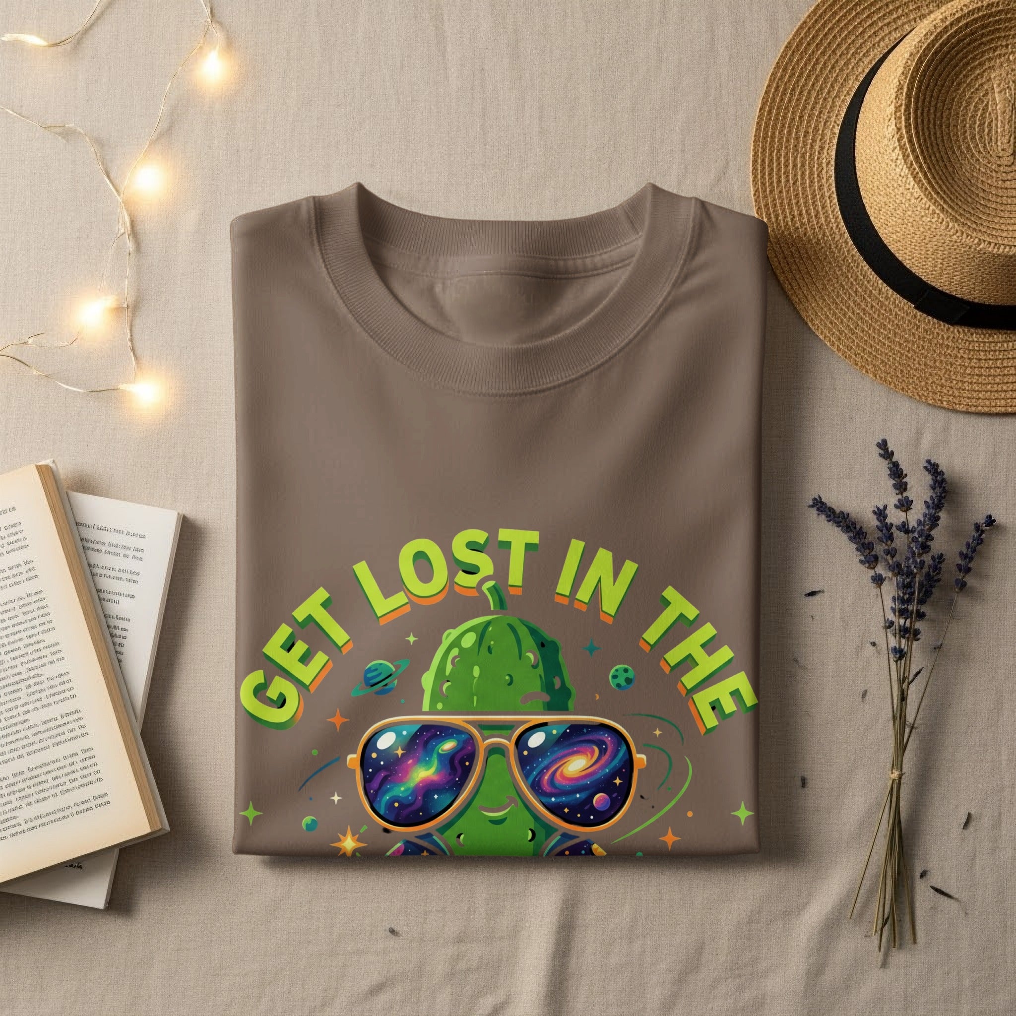 T-shirt with "GET LOST IN THE" text and a cosmic pickle wearing sunglasses.