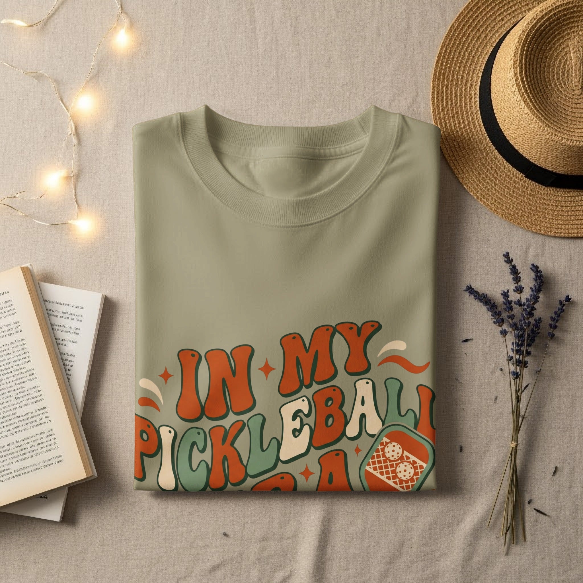 Green t-shirt with "In My Pickleball Era" text and pickleball graphic.