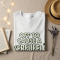 White t-shirt with "OFF TO CAUSE A VERFUFFIL" and a cannabis leaf graphic.