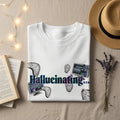 White t-shirt with "Hallucinating..." text and melting clocks.