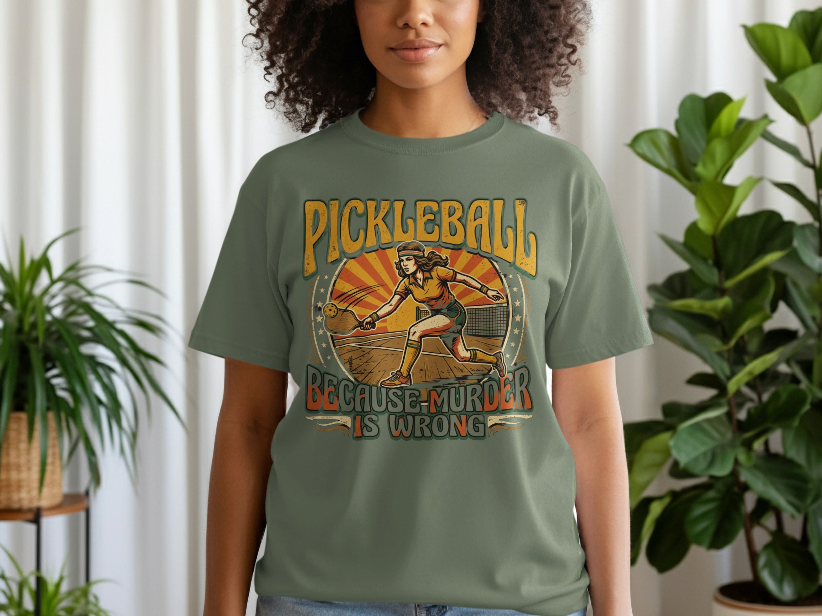 Pickleball graphic tee with a female player and text "Pickleball is Murder."