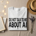 White sweatshirt with "DO NOT TALK TO ME ABOUT AI" text in black dripping letters.