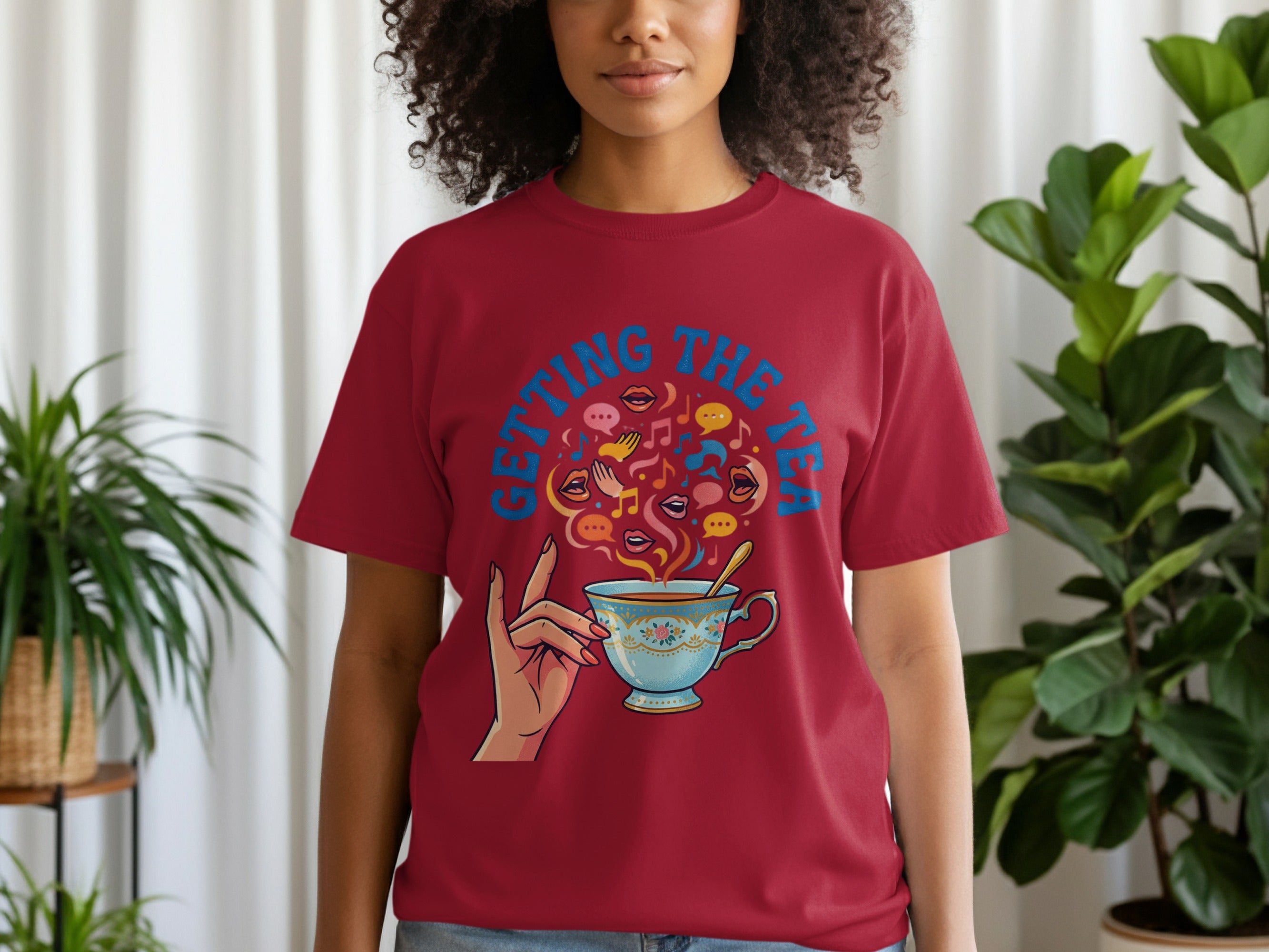 Crimson t-shirt with blue teacup and "GETTING THE TEA" text.
