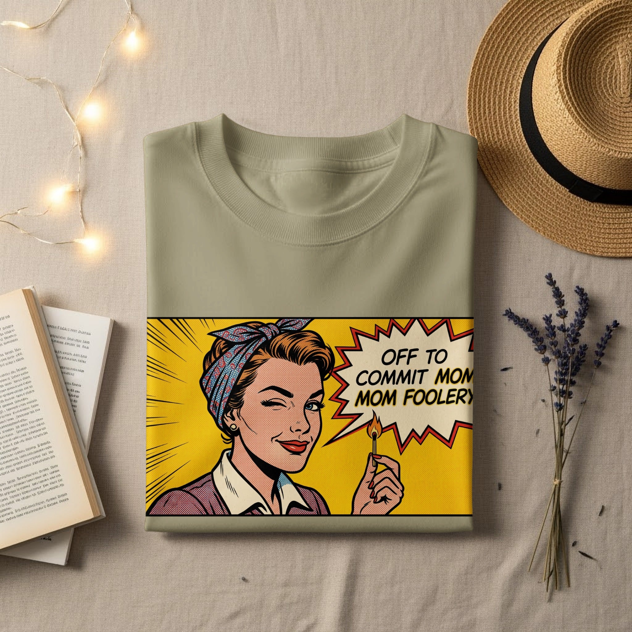 T-shirt with comic book style woman holding a lit match, saying "OFF TO COMMIT MOM FOOLERY".
