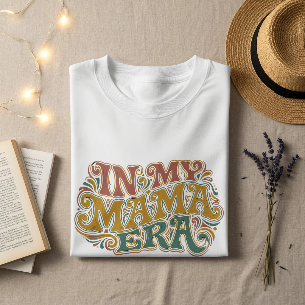 White t-shirt with "IN MY MAMA ERA" in retro colorful text.