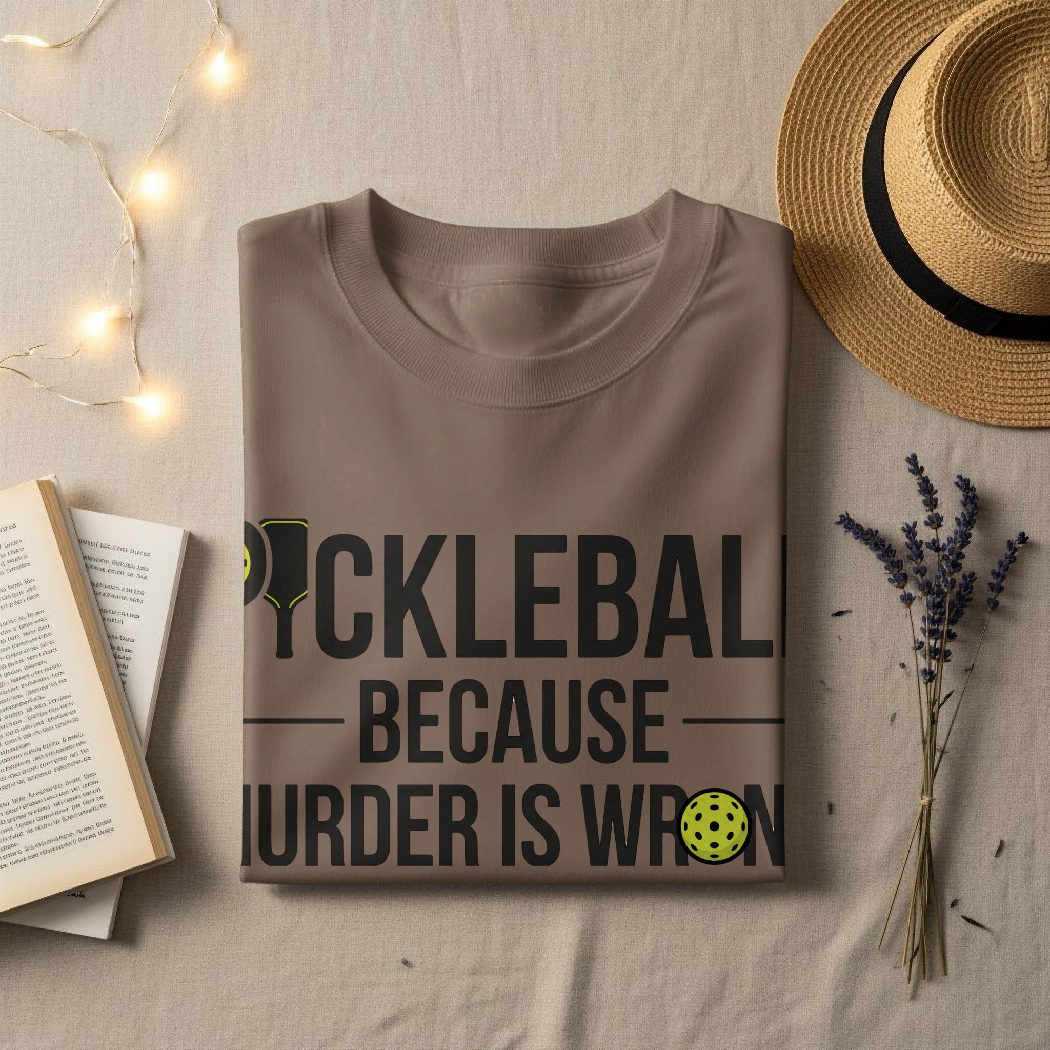 T-shirt with "PICKLEBALL BECAUSE MURDER IS WRONG" text and pickleball graphic.
