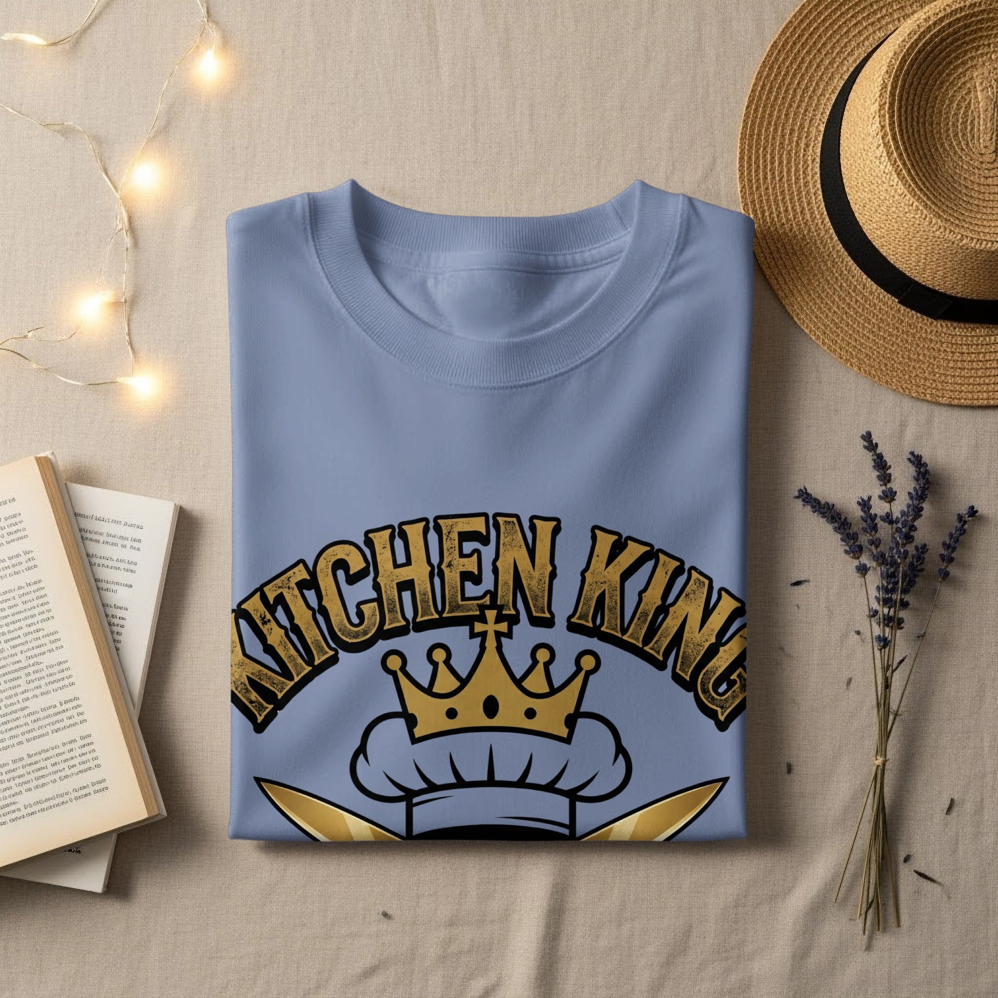 Light blue t-shirt with "KITCHEN KING" in gold lettering and a chef's hat.