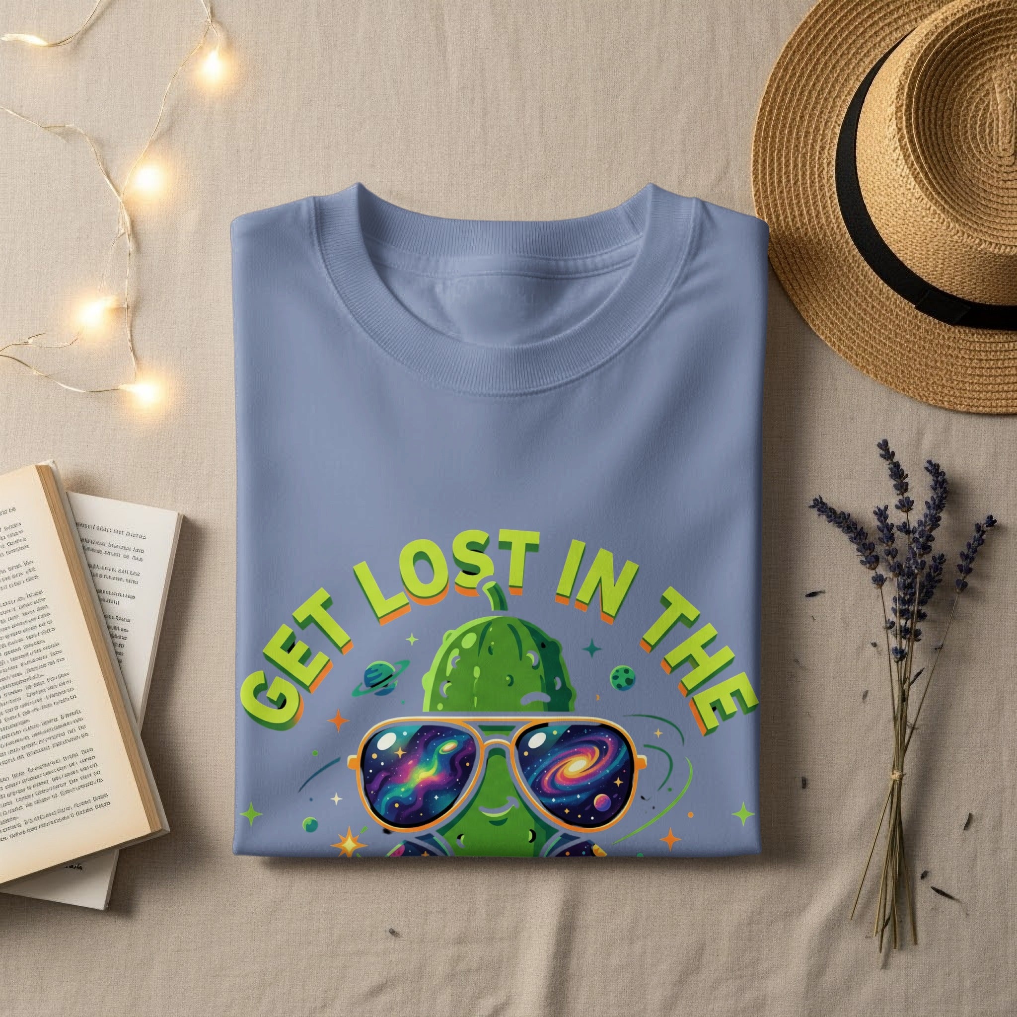 Purple t-shirt with "GET LOST IN THE" text and a galaxy-themed sunglasses-wearing pickle graphic.