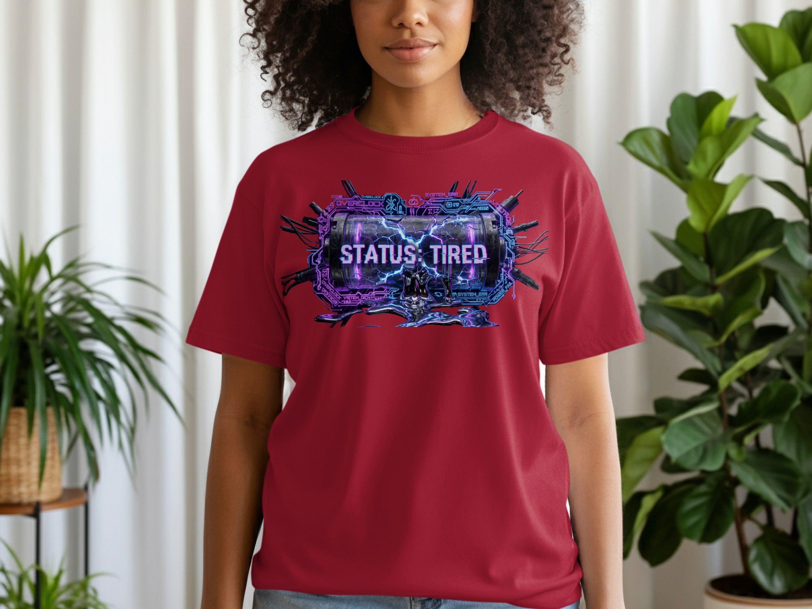 Maroon t-shirt with "STATUS: TIRED" graphic in electric purple and blue.