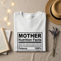 White t-shirt with "MOTHER Nutrition Facts Patience 1000%" graphic.