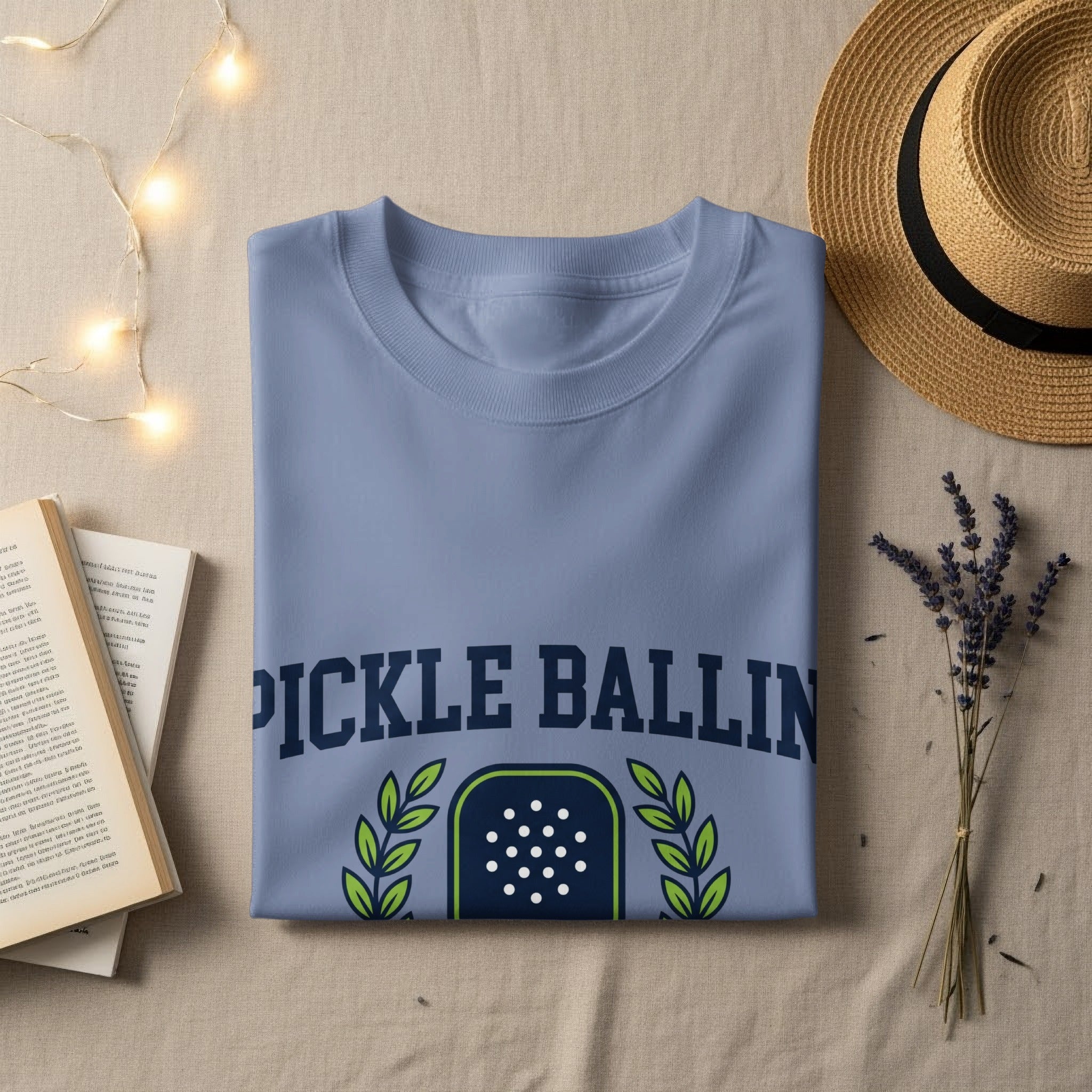 Blue t-shirt with "PICKLE BALLIN" and pickleball court graphic.