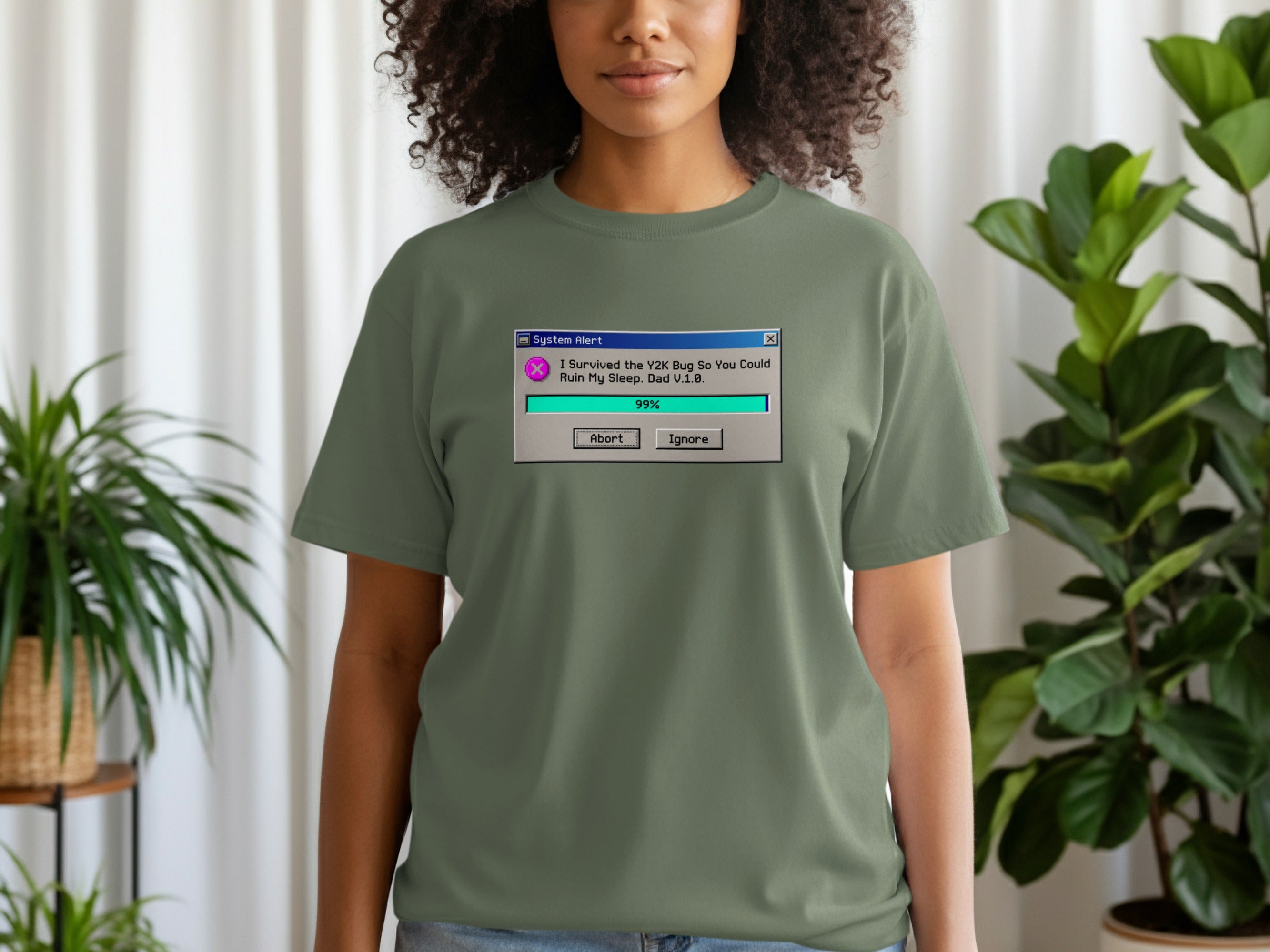 Green t-shirt with "System Alert" pop-up text about the Y2K bug.