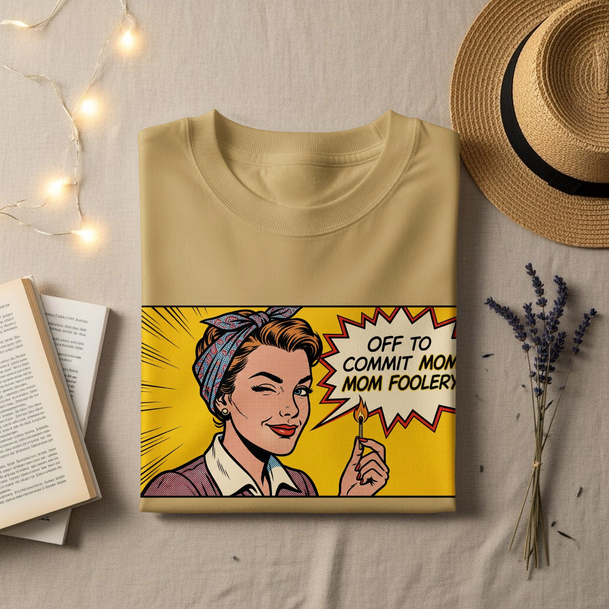 Tan t-shirt with retro comic art of a woman winking, holding a lit match.