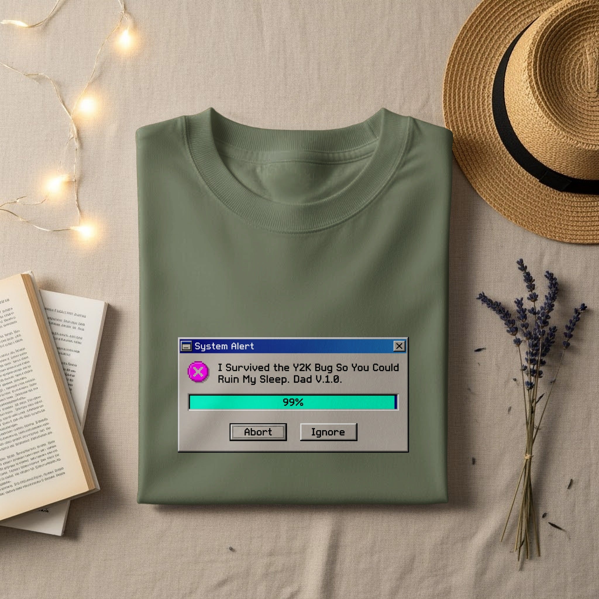 Olive green t-shirt with "System Alert" box and Y2K bug text.
