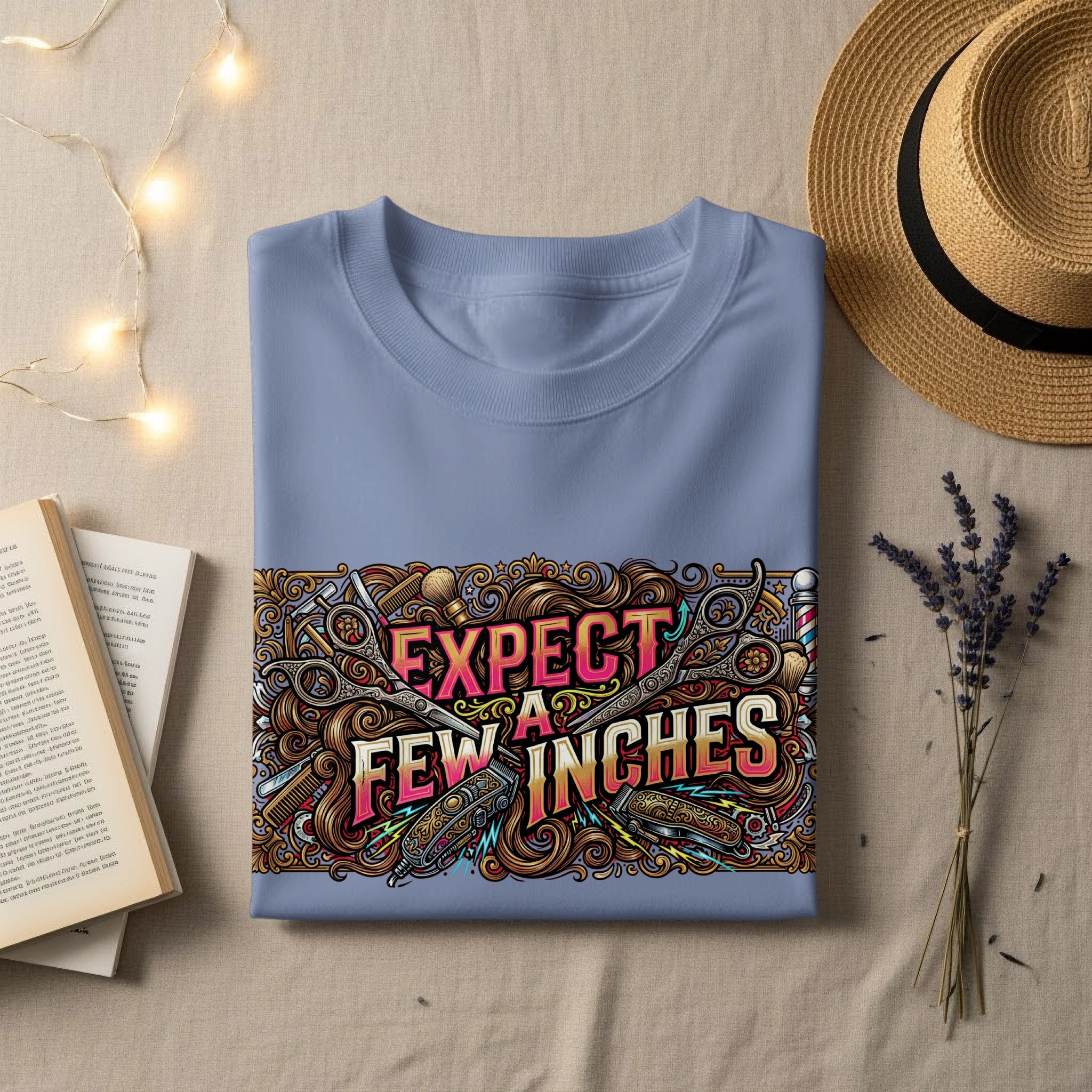 Blue t-shirt with "EXPECT FEW INCHES" text and barber graphics.