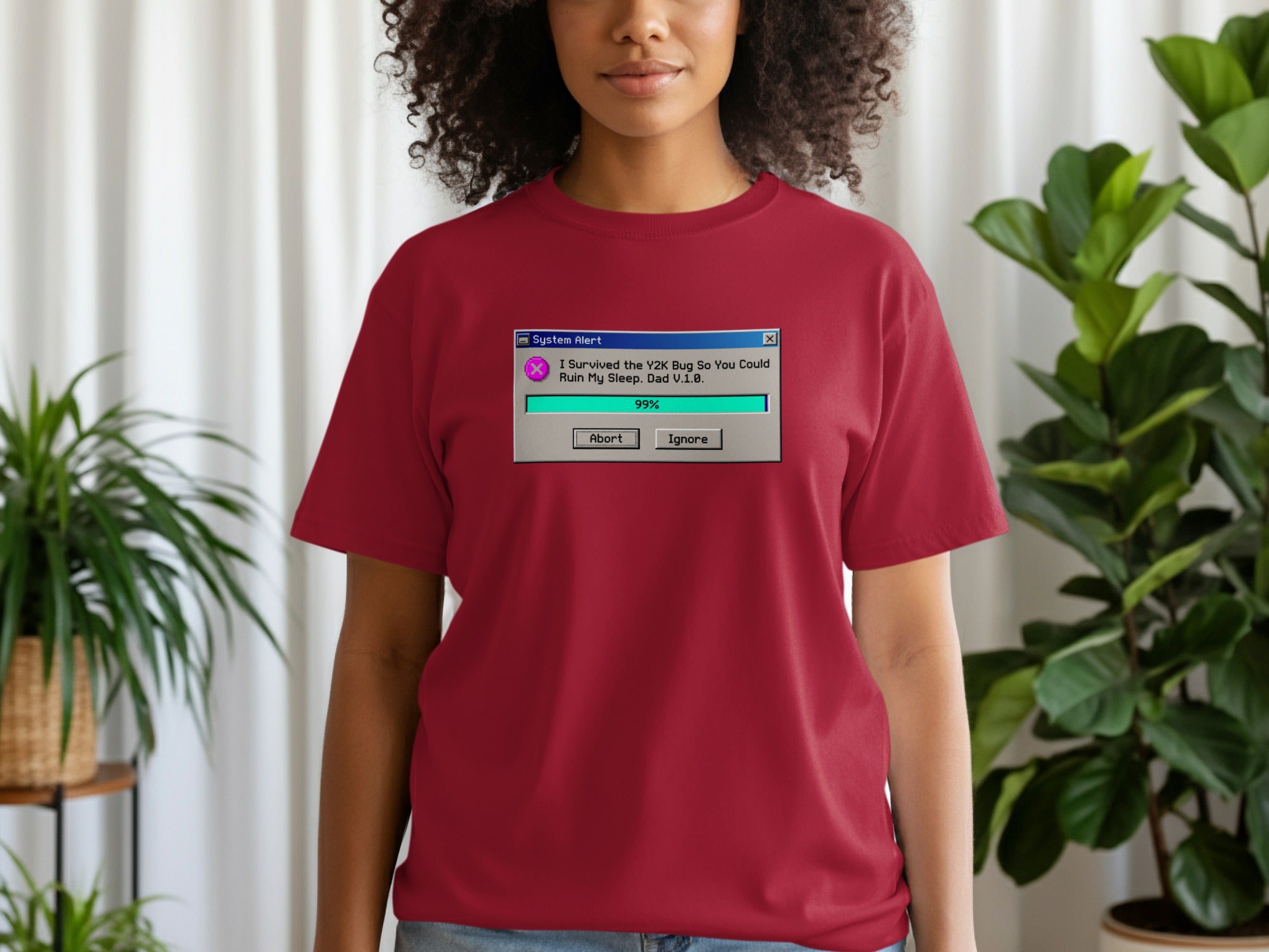Maroon t-shirt with a vintage system alert graphic about the Y2K bug.