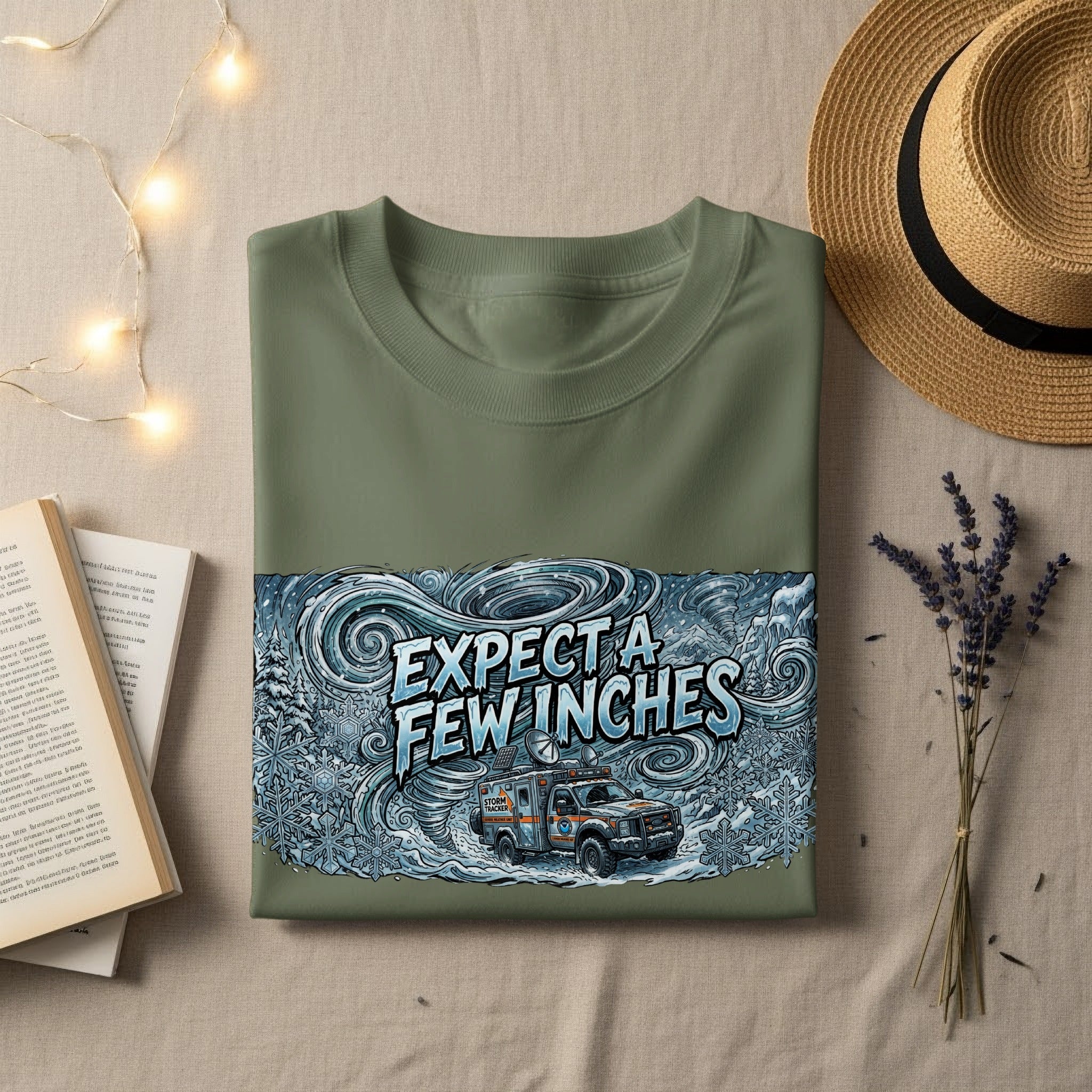 Green t-shirt with "EXPECT A FEW INCHES" and storm tracker van graphic.