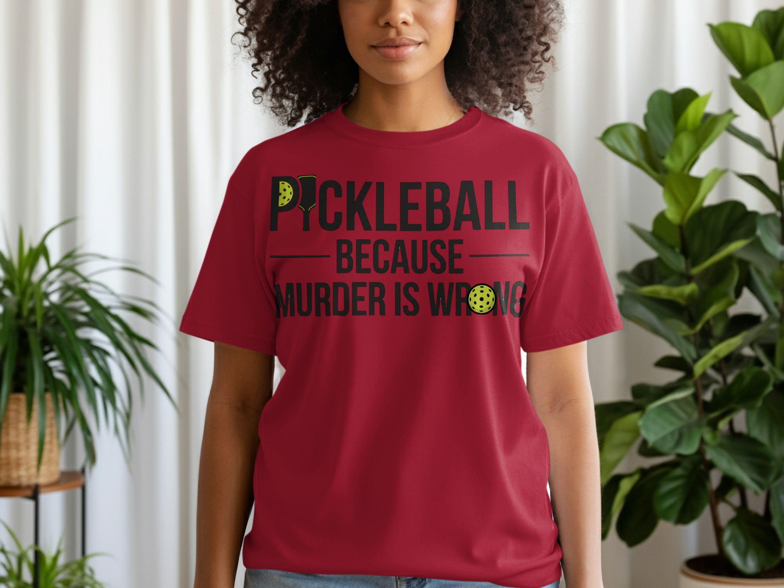 Maroon t-shirt with "Pickleball Because Murder Is Wrong" text and pickleball graphic.