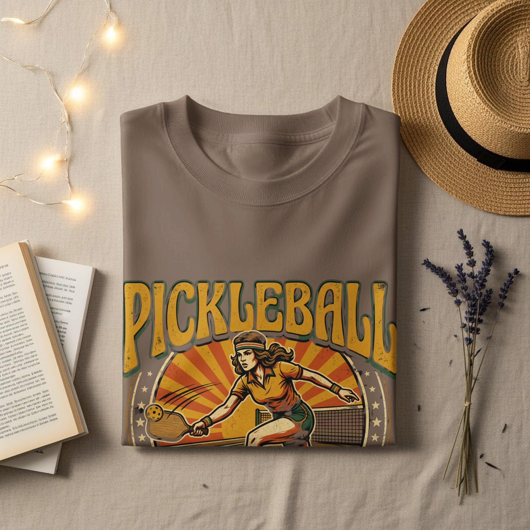 T-shirt with "PICKLEBALL" text and woman playing pickleball graphic.
