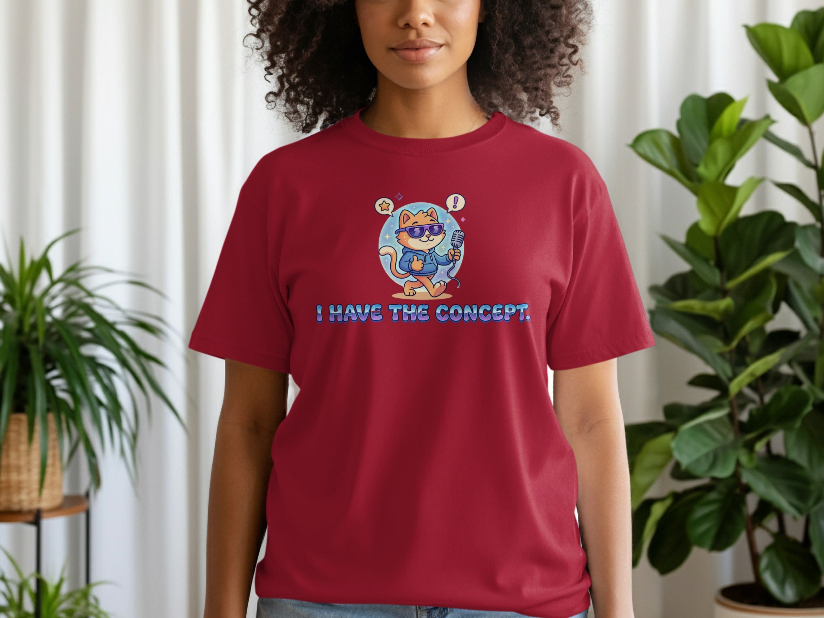 T-shirt with a cartoon cat wearing sunglasses and holding a microphone.