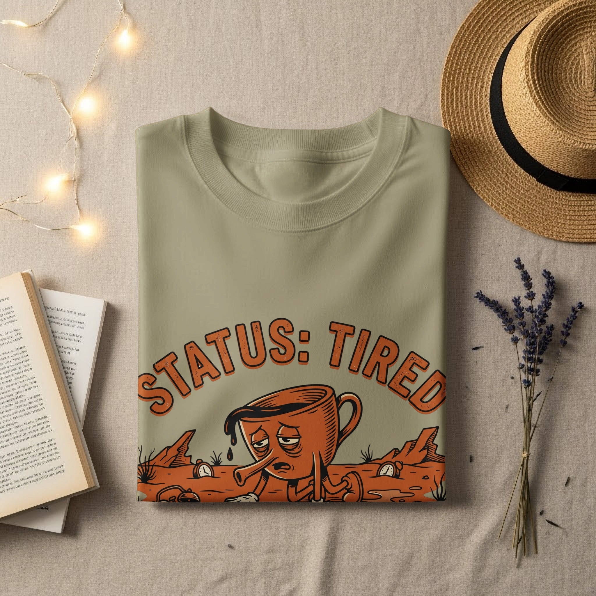 T-shirt with "STATUS: TIRED" text and a tired, sad coffee cup graphic.