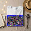 White t-shirt with "HALLUCINATING" text and a chaotic, colorful, digital art design.