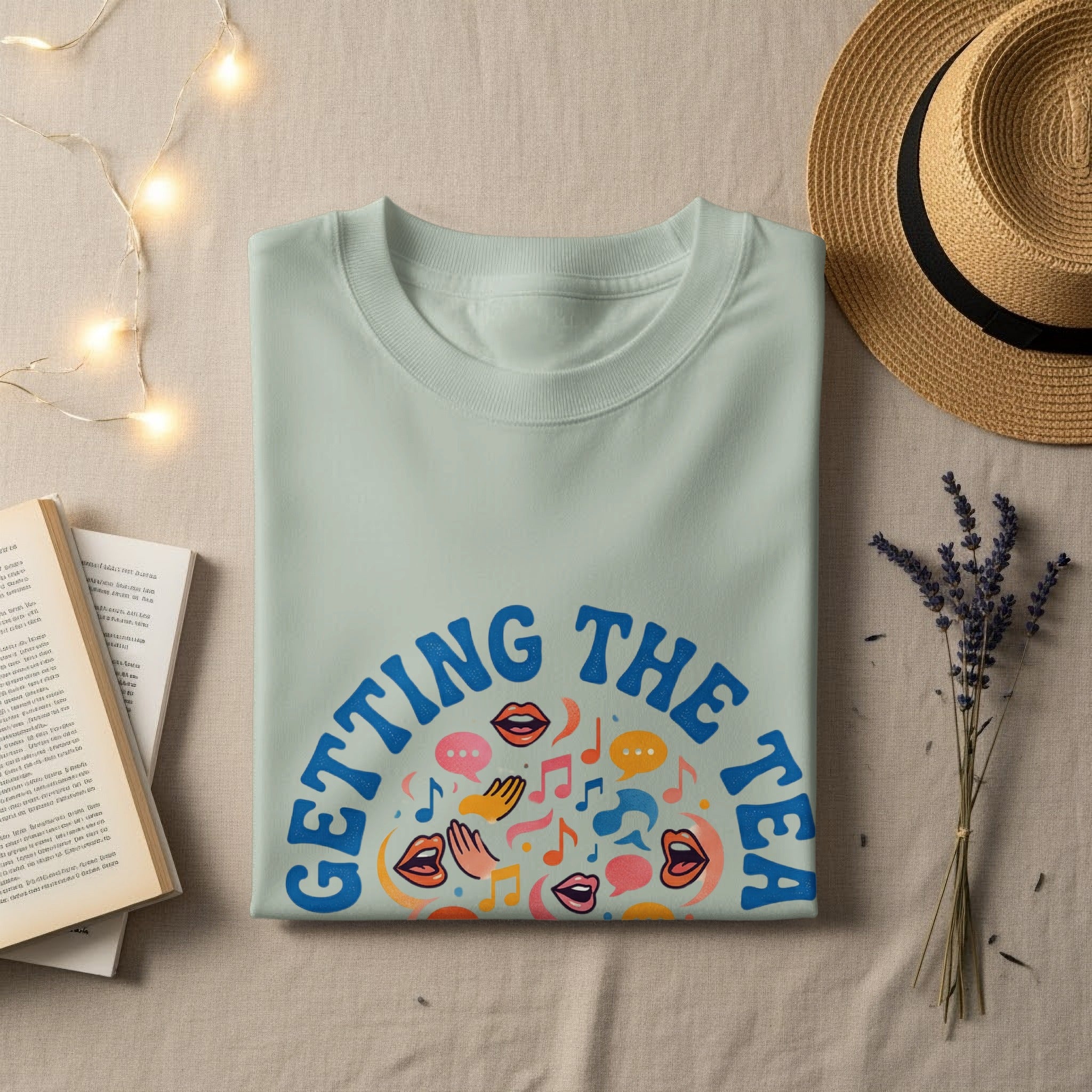 Light mint green t-shirt with "GETTING THE TEA" and colorful speech bubbles.