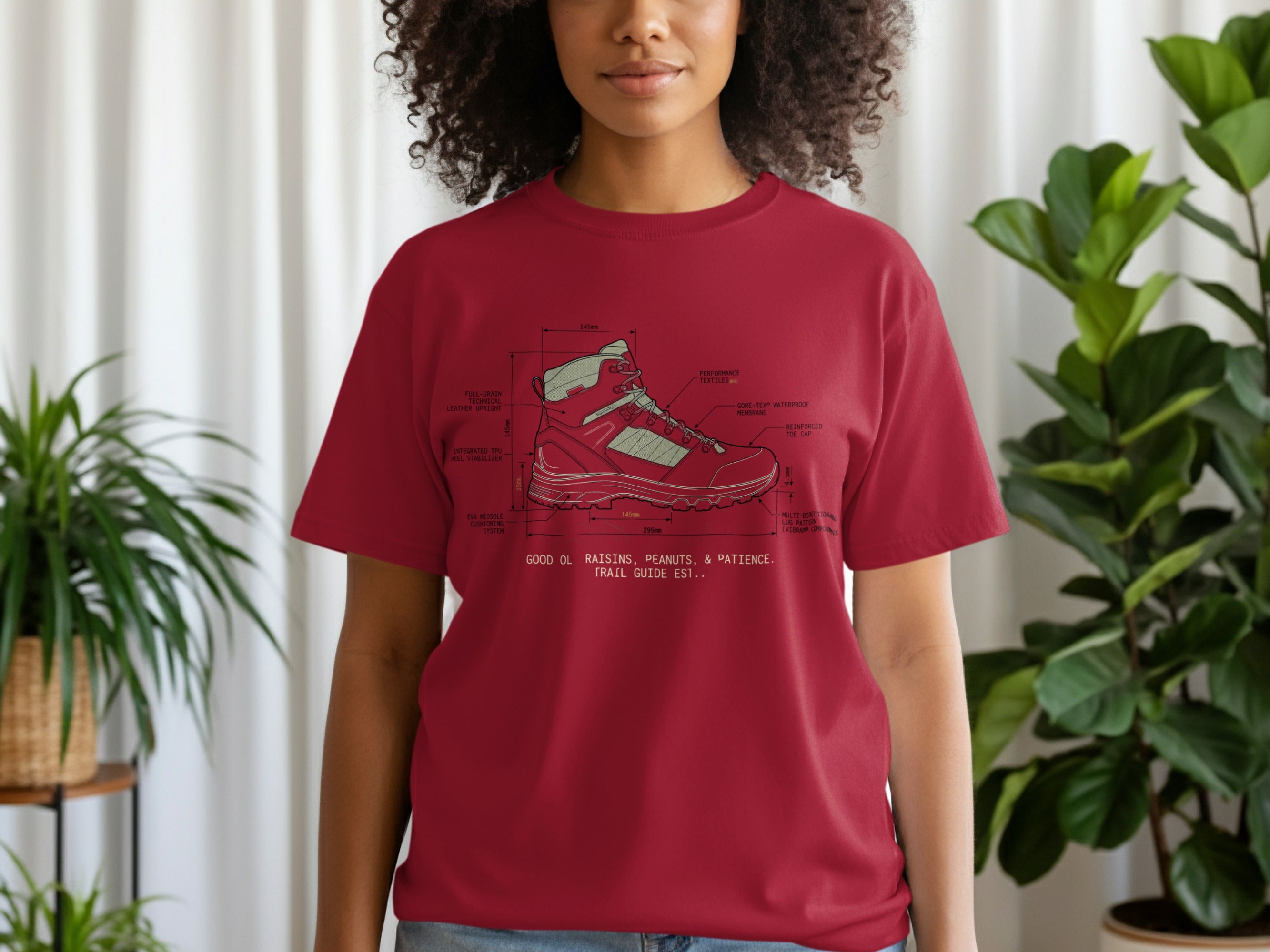 T-shirt with diagram of hiking boot, labeling its technical features and construction.