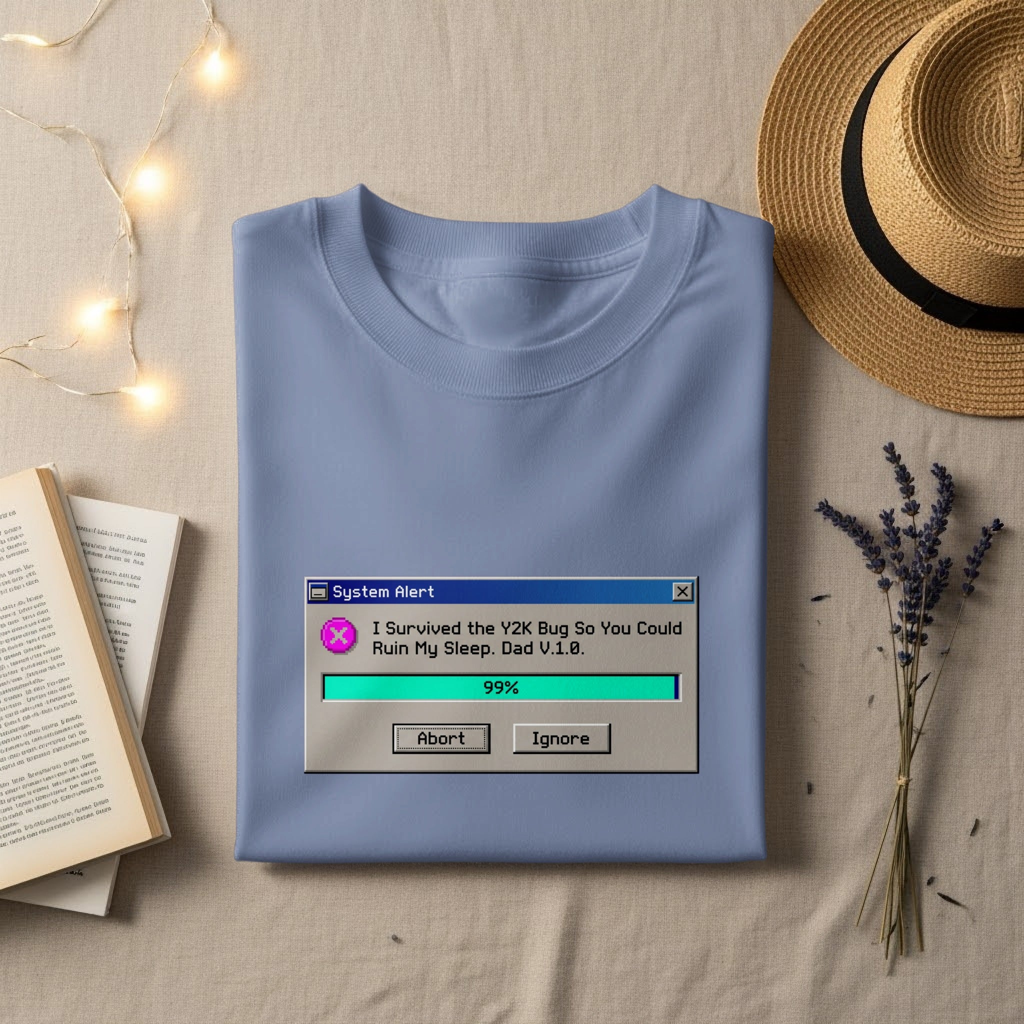 Light blue t-shirt with a Y2K bug system alert graphic and text.